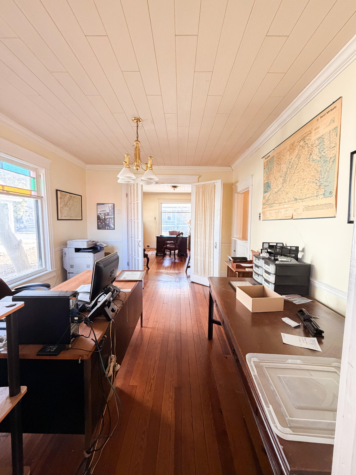226 West Locust Street Covington, VA 24426 - Photo 14 of 45 a living room with furniture and a chandelier