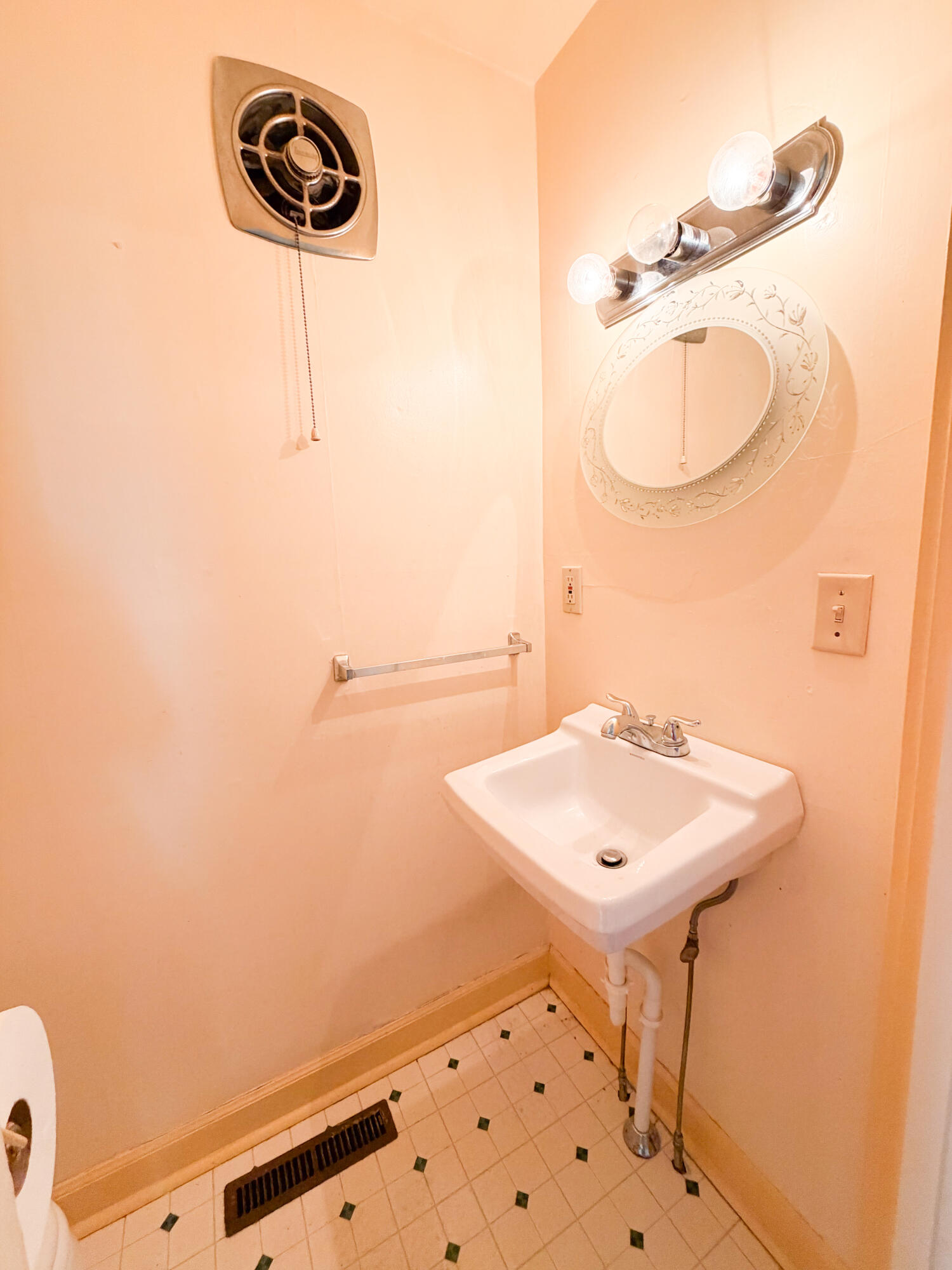 226 West Locust Street Covington, VA 24426 - Photo 20 of 45 a bathroom with a sink a light fixture and a mirror