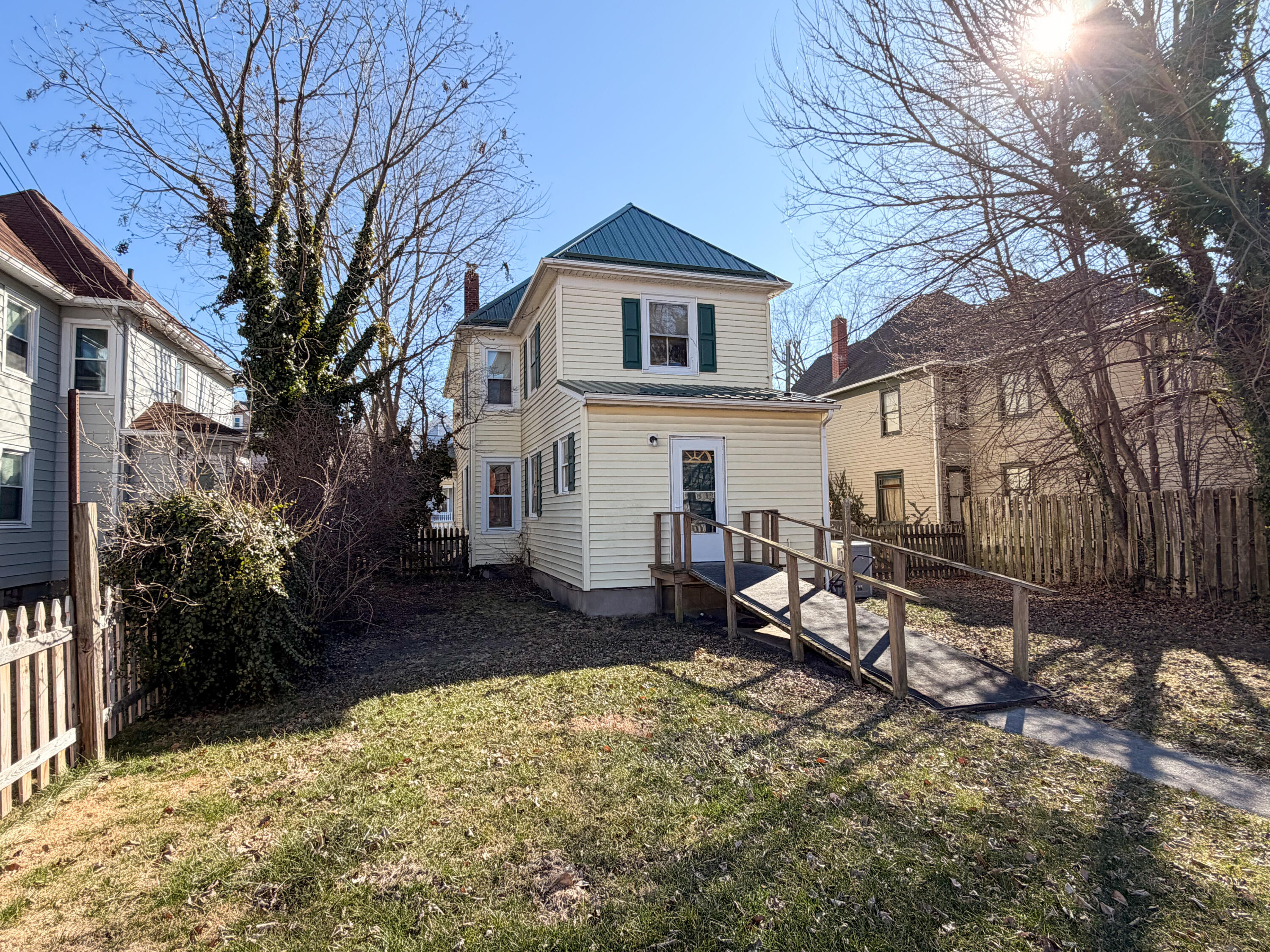 226 West Locust Street Covington, VA 24426 - Photo 35 of 45 a white house that has a tree in front of it