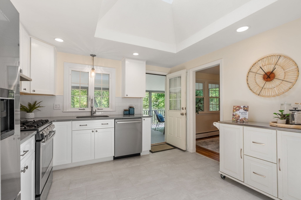 11 Longmeadow Road Medfield, MA 02052 - Photo 9 of 39 a kitchen with white cabinets and window