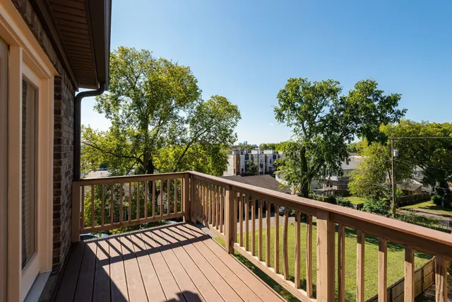 a view of a balcony with wooden floor