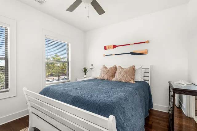 a bedroom with a bed and ceiling fan
