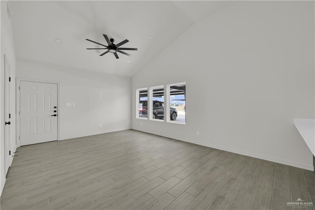 2612 Robin Road, Unit #3 Weslaco, TX 78596 - Photo 11 of 23 a view of a livingroom with a ceiling fan and window