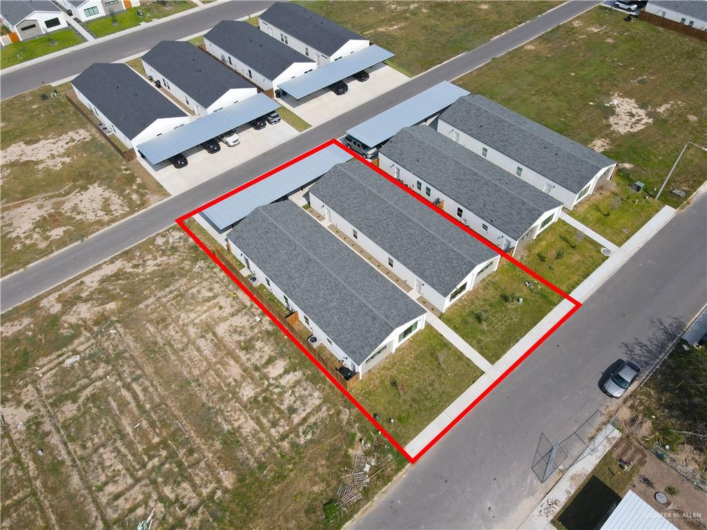 2612 Robin Road, Unit #3 Weslaco, TX 78596 - Photo 19 of 23 an aerial view of a tennis ground with a large tree