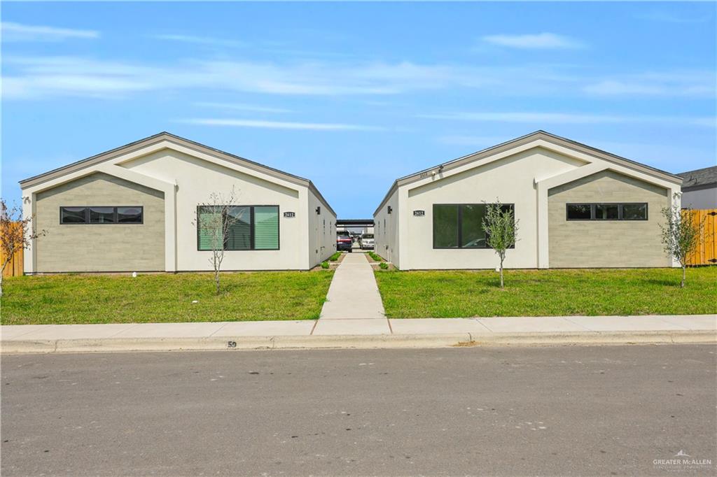 2612 Robin Road, Unit #3 Weslaco, TX 78596 - Photo 2 of 23 a front view of house with yard and green space