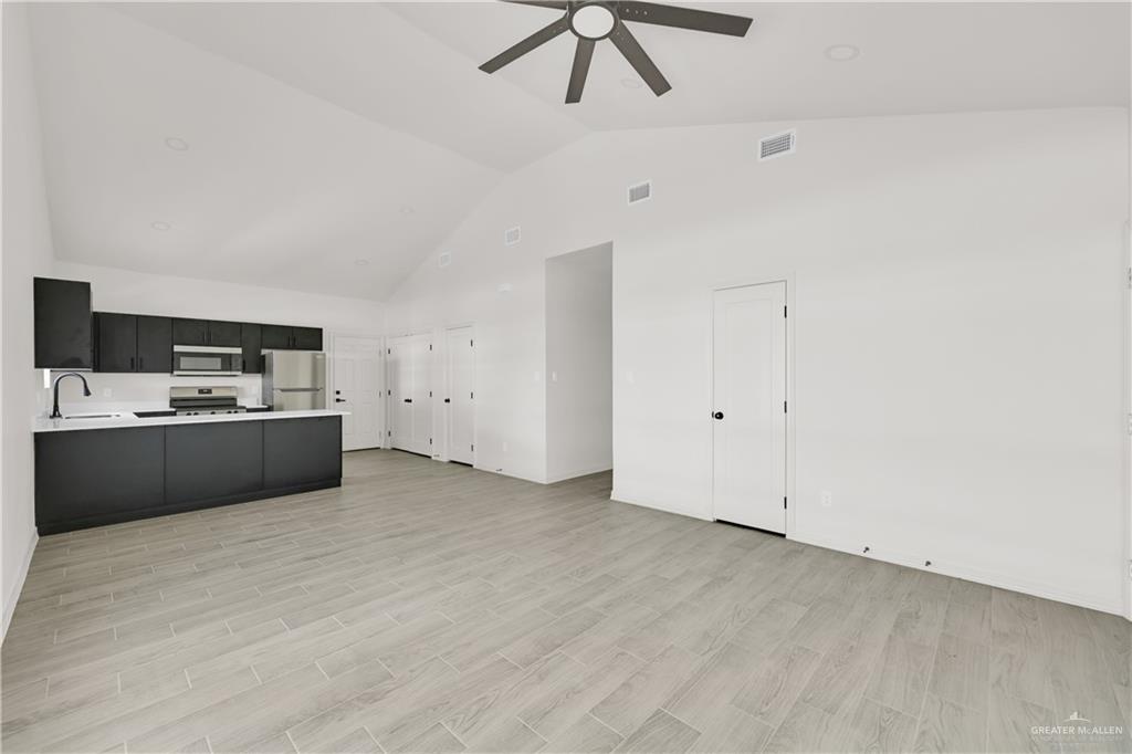 2612 Robin Road, Unit #3 Weslaco, TX 78596 - Photo 6 of 23 a view of kitchen with wooden floor
