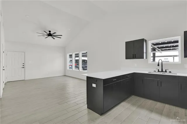 a kitchen with a sink and cabinets