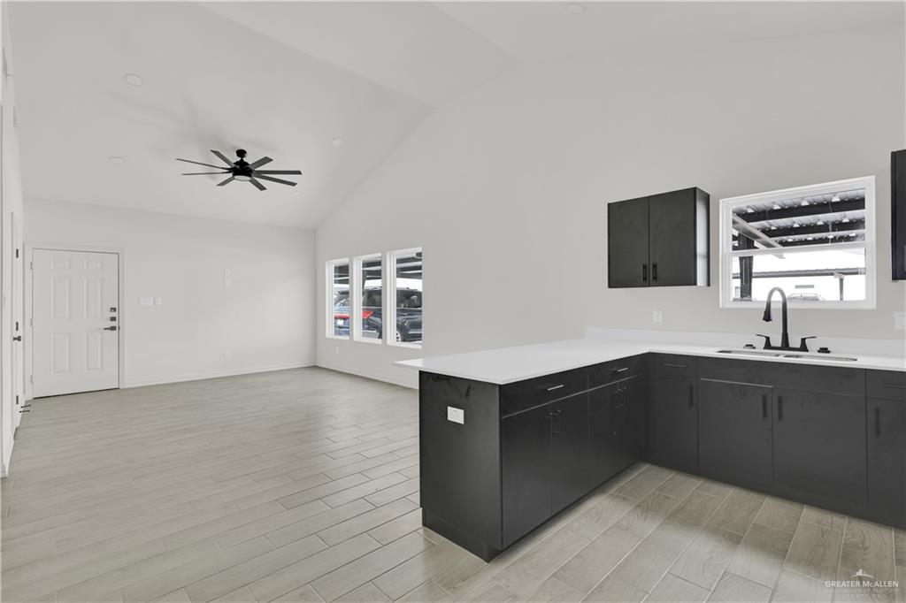 2612 Robin Road, Unit #3 Weslaco, TX 78596 - Photo 9 of 23 a kitchen with a sink and cabinets