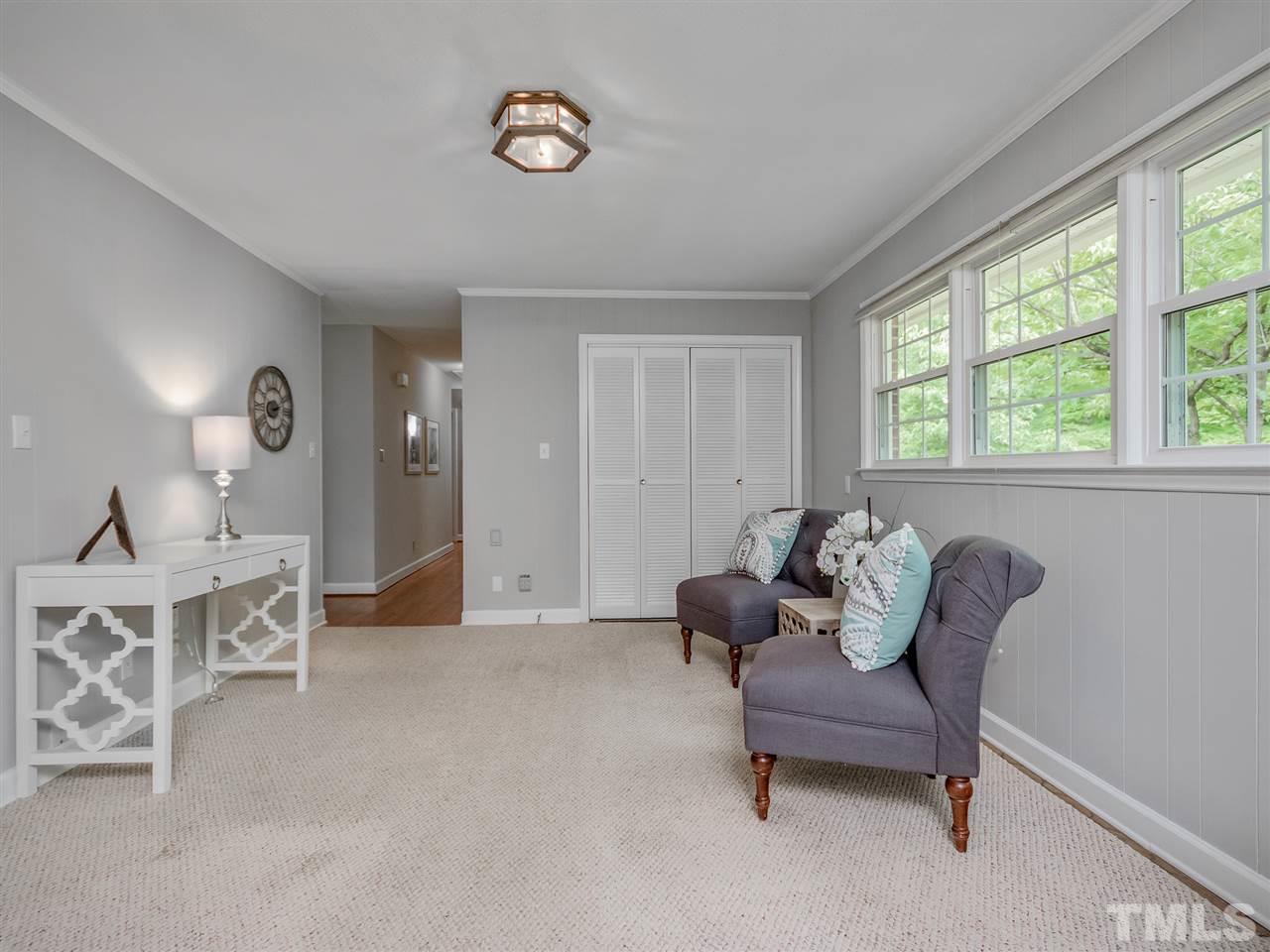 4912 Biscayne Road Durham, NC 27707 - Photo 13 of 25 A view from the kitchen through the sitting area and down the hall