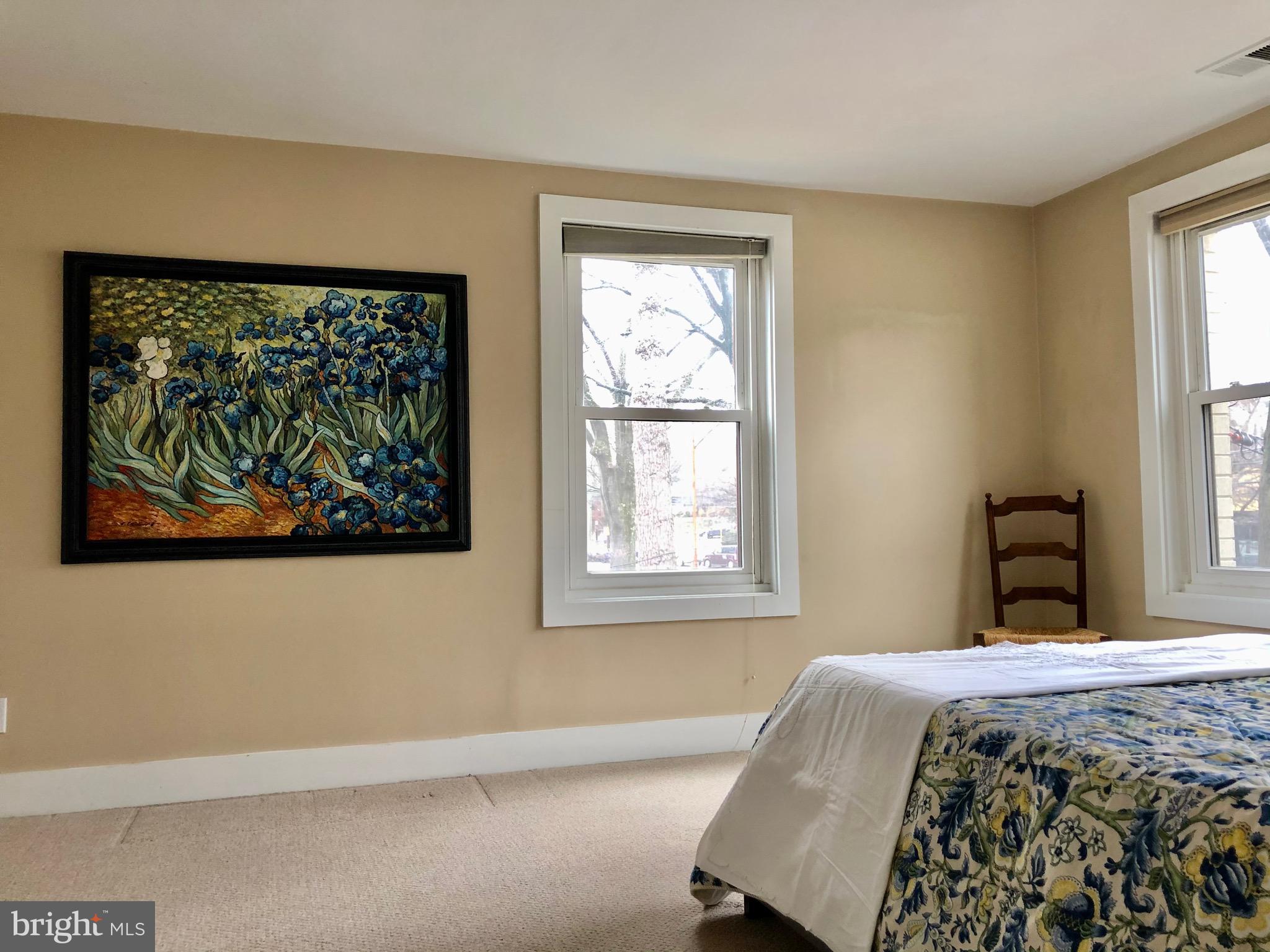 4840 MacArthur Boulevard Northwest, Unit 501 Washington, DC 20007 - Photo 12 of 24 a bedroom with a bed and a window