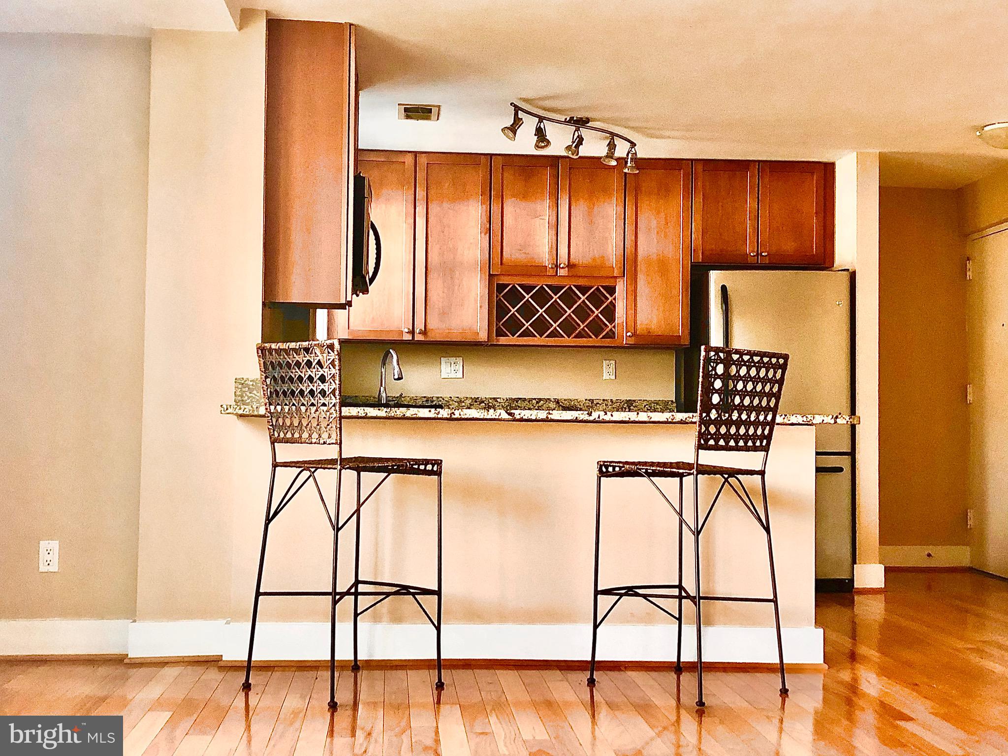 4840 MacArthur Boulevard Northwest, Unit 501 Washington, DC 20007 - Photo 6 of 24 a view of a kitchen with furniture and window