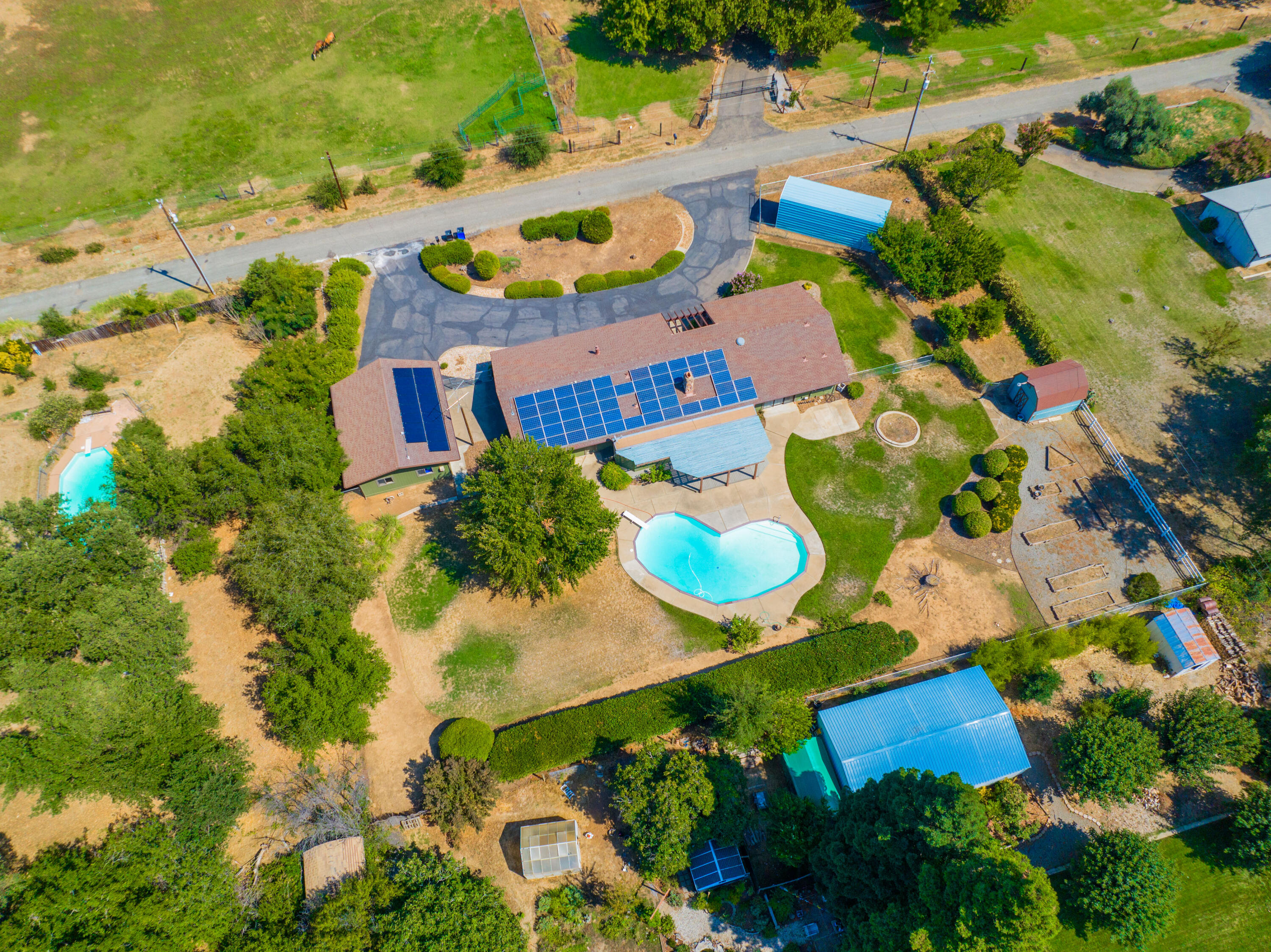 15715 Johnson Road Red Bluff, CA 96080 - Photo 54 of 61 an aerial view of a house with yard swimming pool and outdoor seating