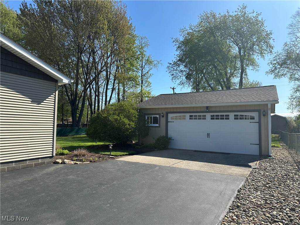 157 Birch Road Painesville, OH 44077 - Photo 35 of 41 View of front facade with a garage, an outbuilding, and driveway