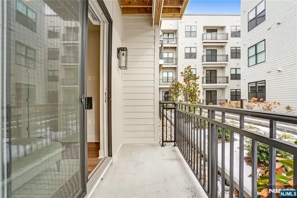 a view of balcony with a glass door