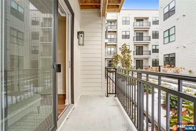 a view of balcony with a glass door