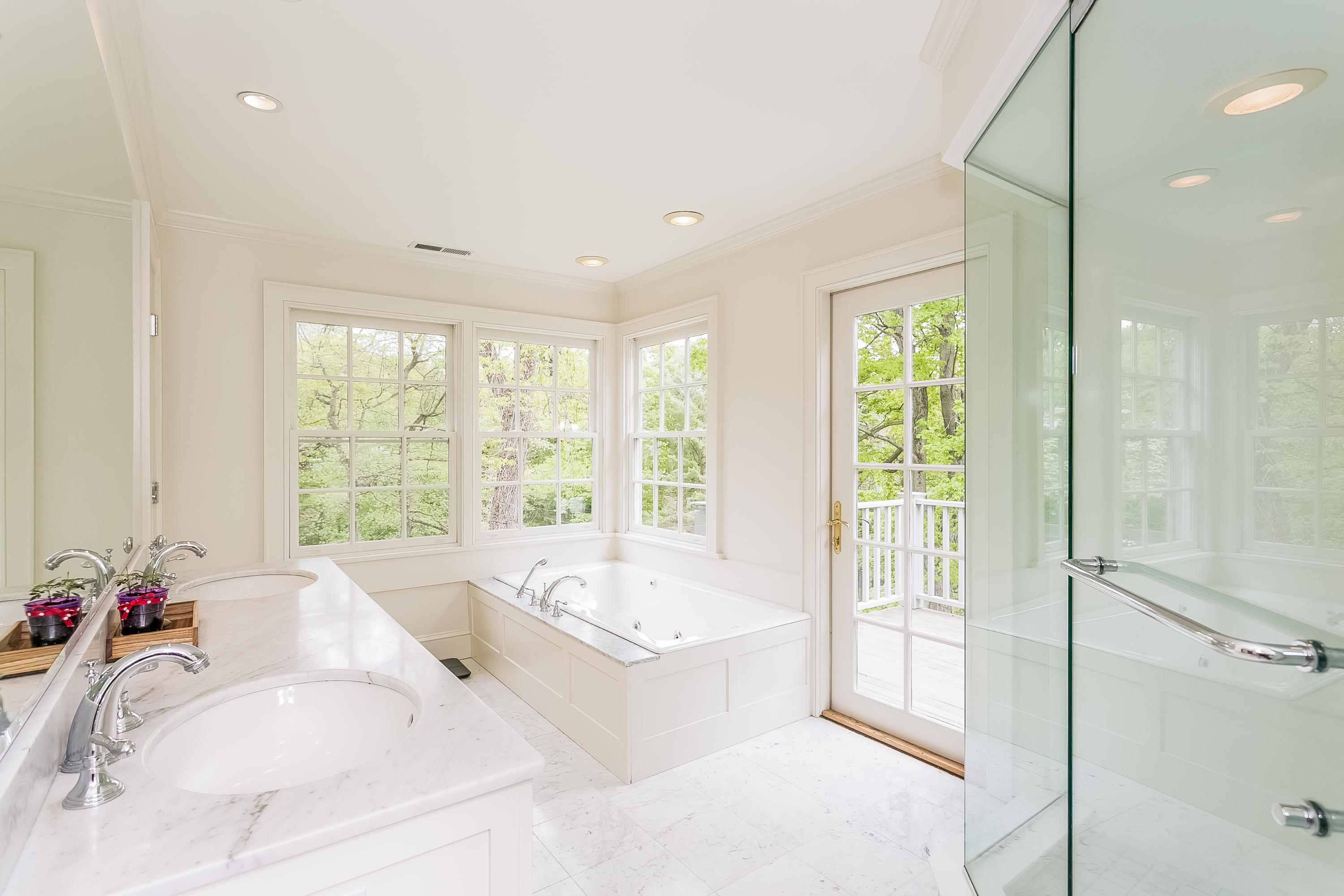 33 Tory Hole Road Darien, CT 06820 - Photo 14 of 24 a spacious bathroom with a tub shower and windows