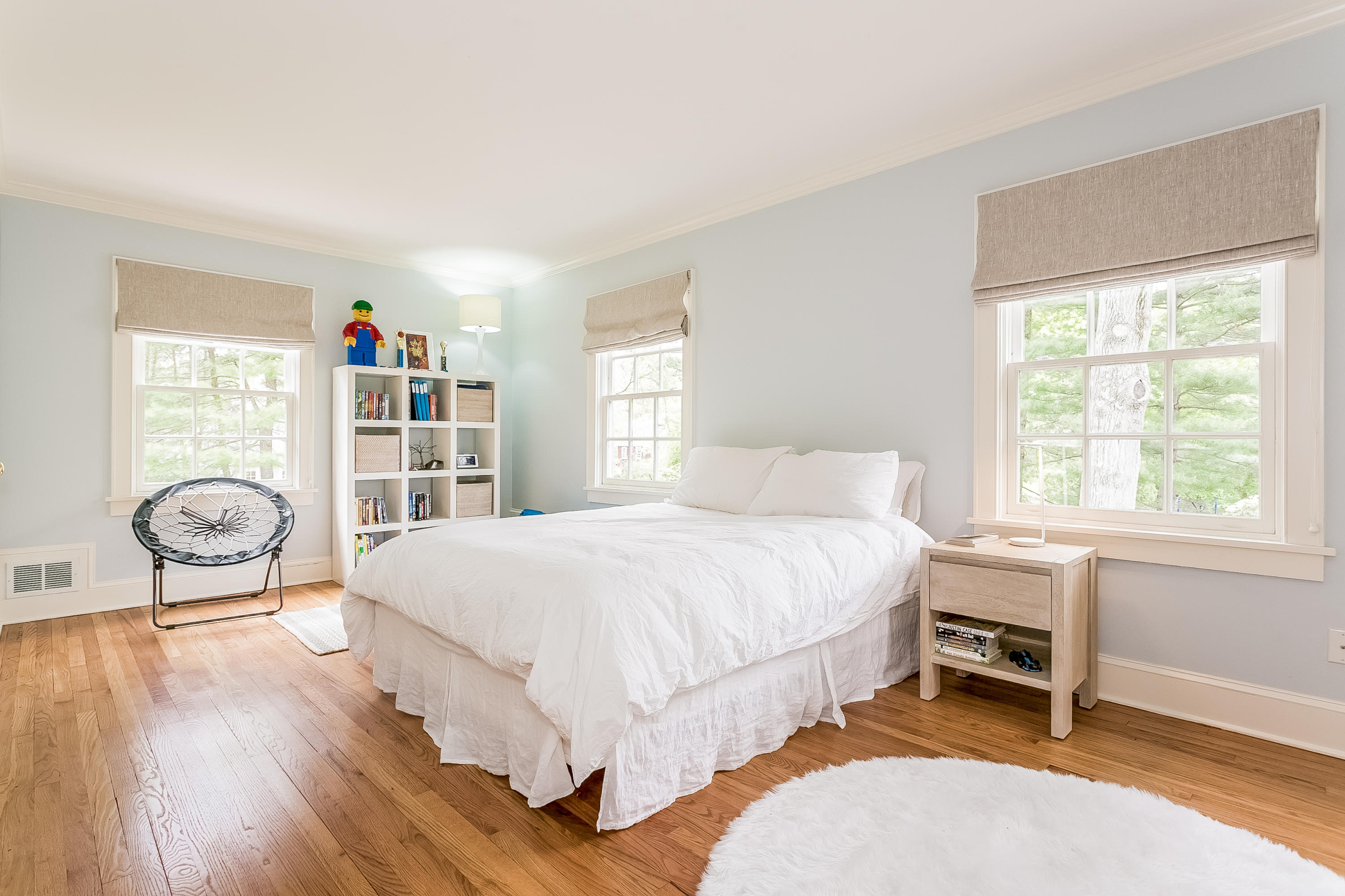 33 Tory Hole Road Darien, CT 06820 - Photo 16 of 24 a bedroom with a bed and a book shelf