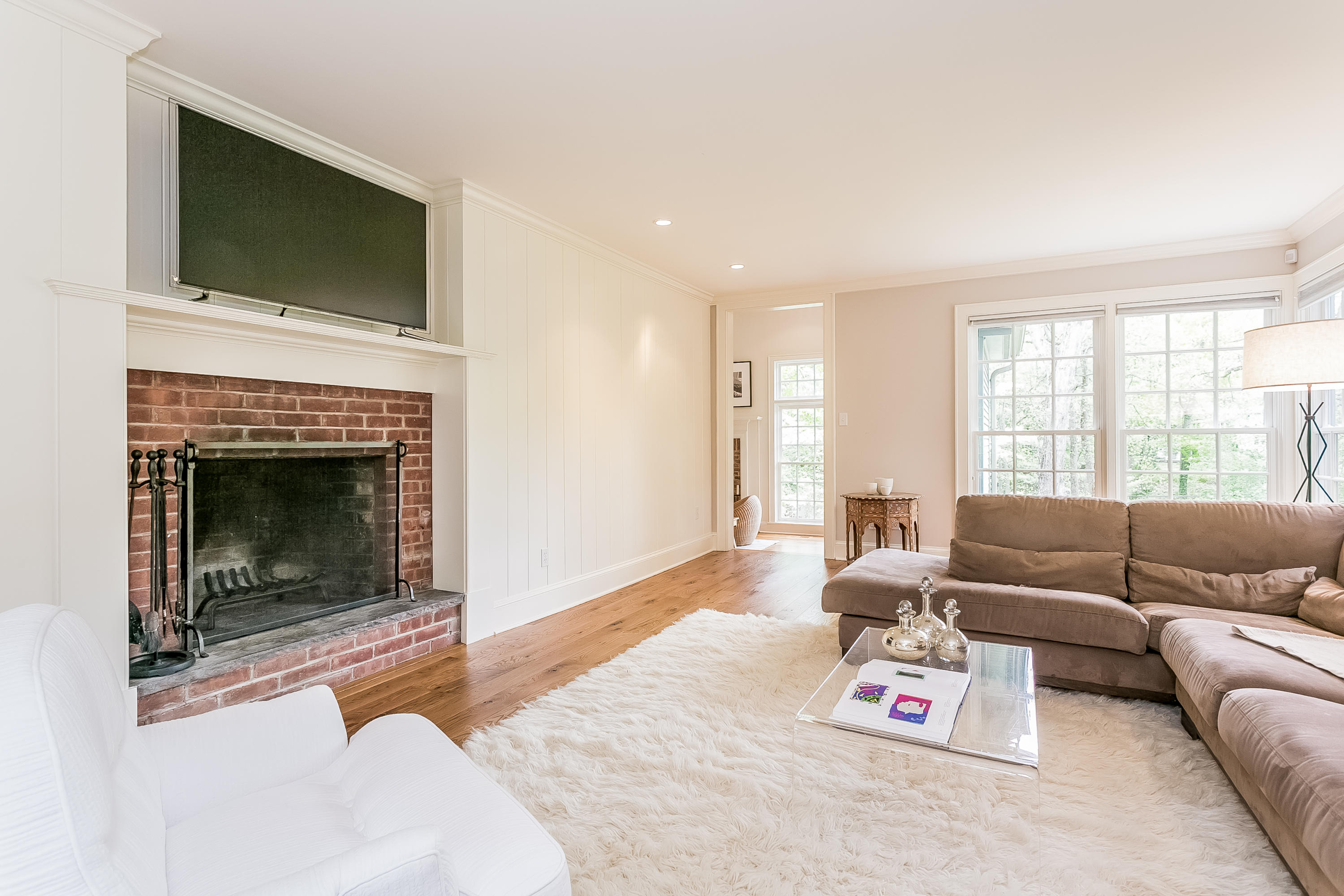 33 Tory Hole Road Darien, CT 06820 - Photo 5 of 24 a living room with furniture a flat screen tv and a fireplace