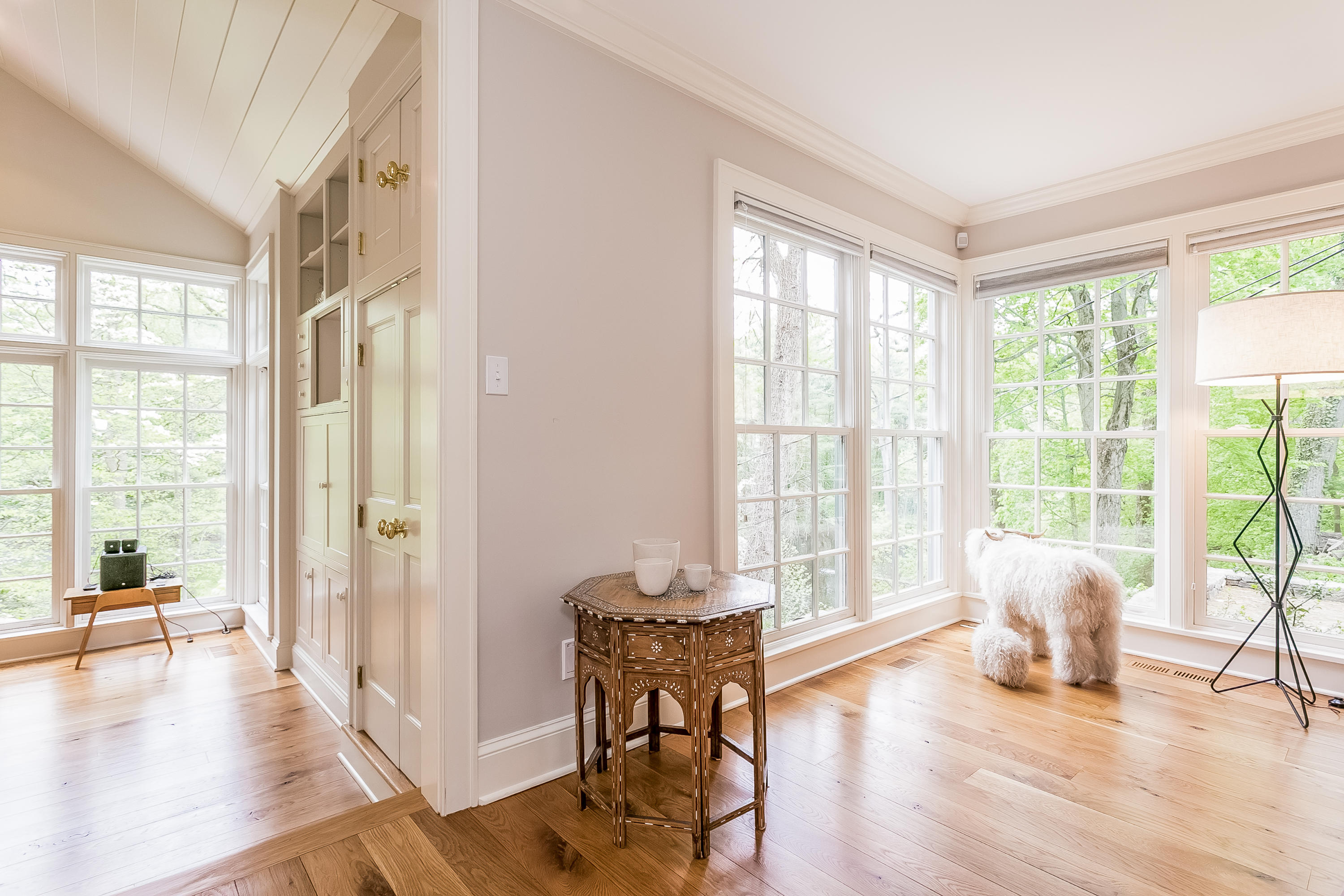 33 Tory Hole Road Darien, CT 06820 - Photo 6 of 24 a view of a livingroom with furniture wooden floor and a floor to ceiling window