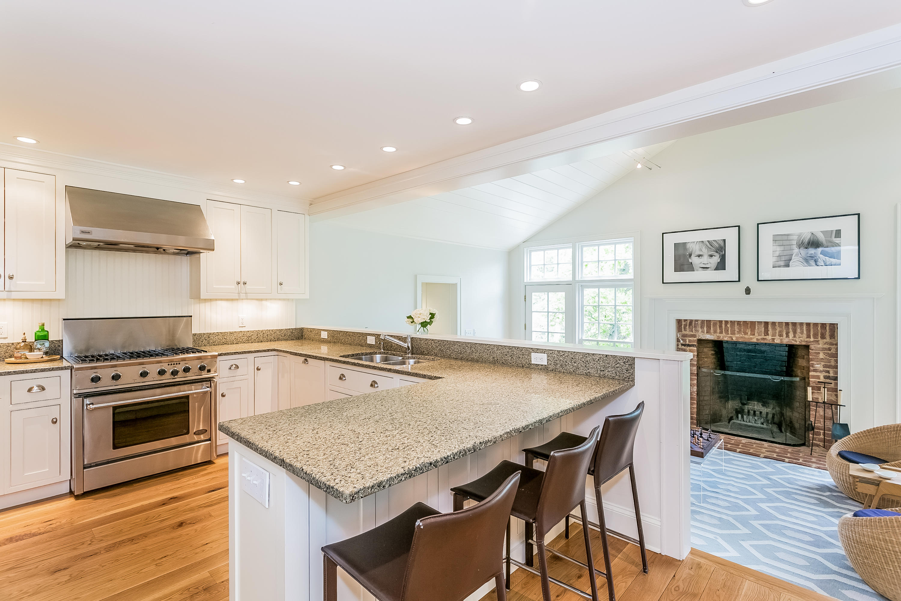 33 Tory Hole Road Darien, CT 06820 - Photo 8 of 24 a kitchen with a stove a table and chairs in it