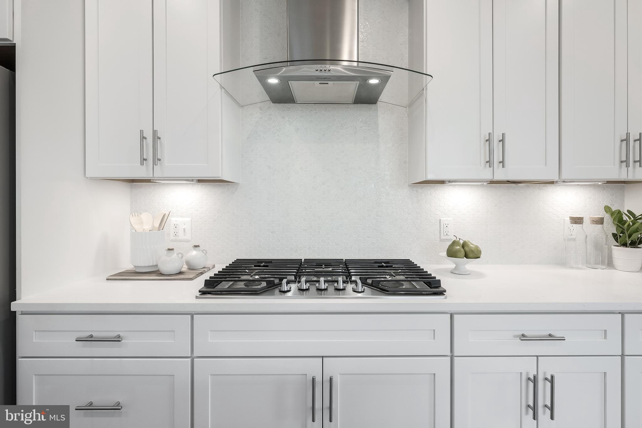 2320 Field Point Road, Unit 201 Herndon, VA 20171 - Photo 16 of 47 a kitchen with white cabinets and appliances