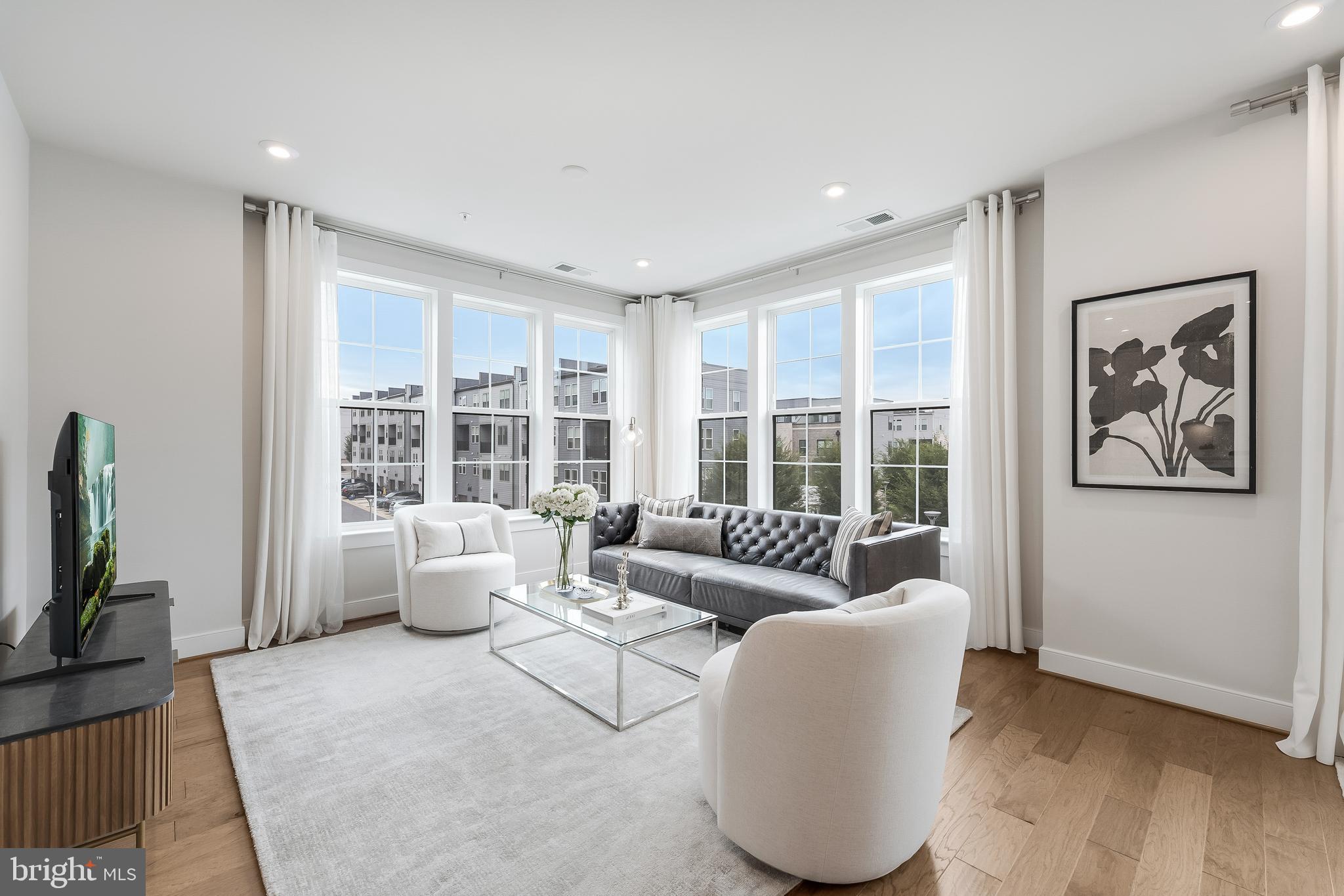 2320 Field Point Road, Unit 201 Herndon, VA 20171 - Photo 21 of 47 a living room with furniture and a large window