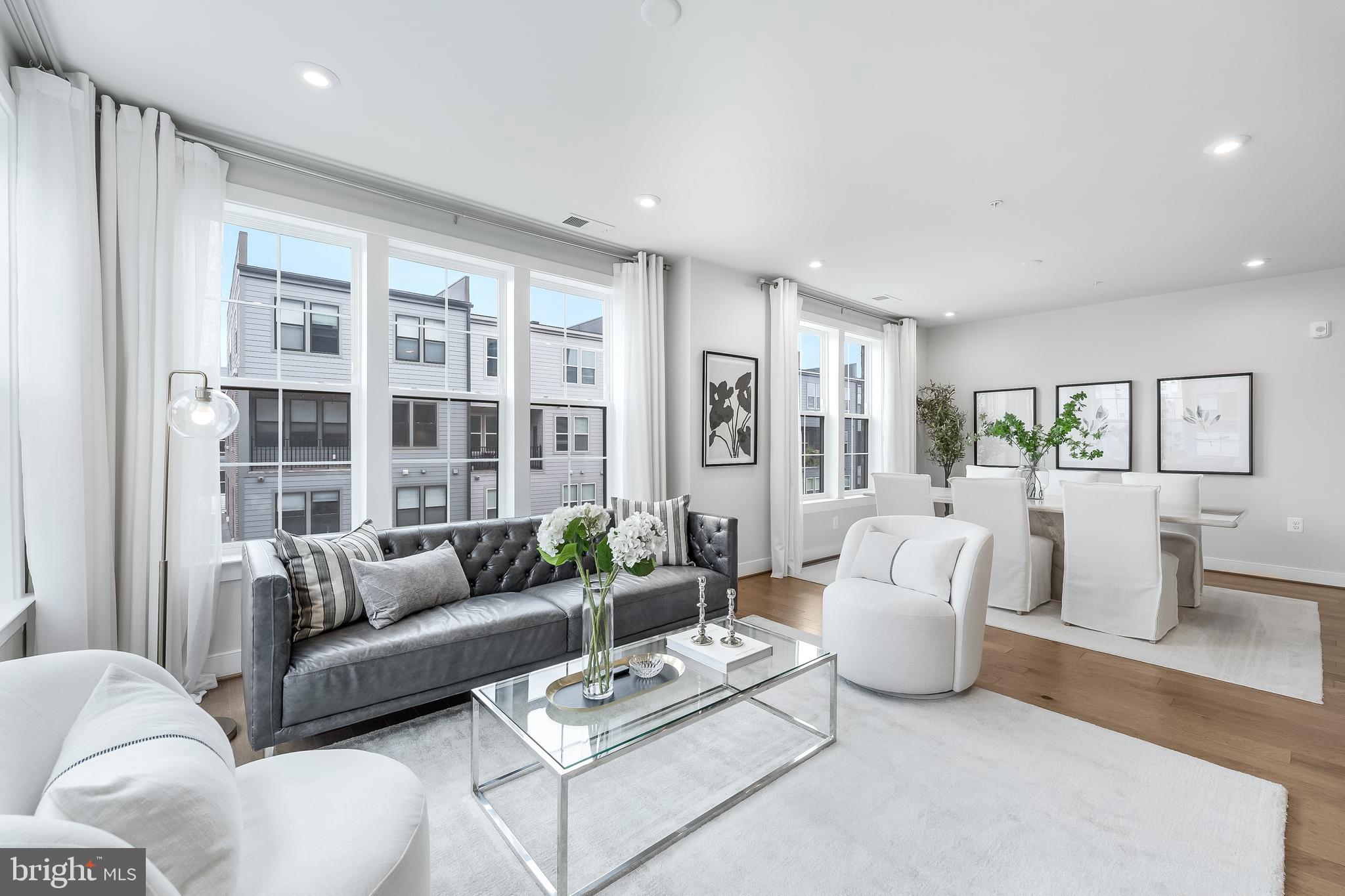 2320 Field Point Road, Unit 201 Herndon, VA 20171 - Photo 22 of 47 a living room with furniture and a large window