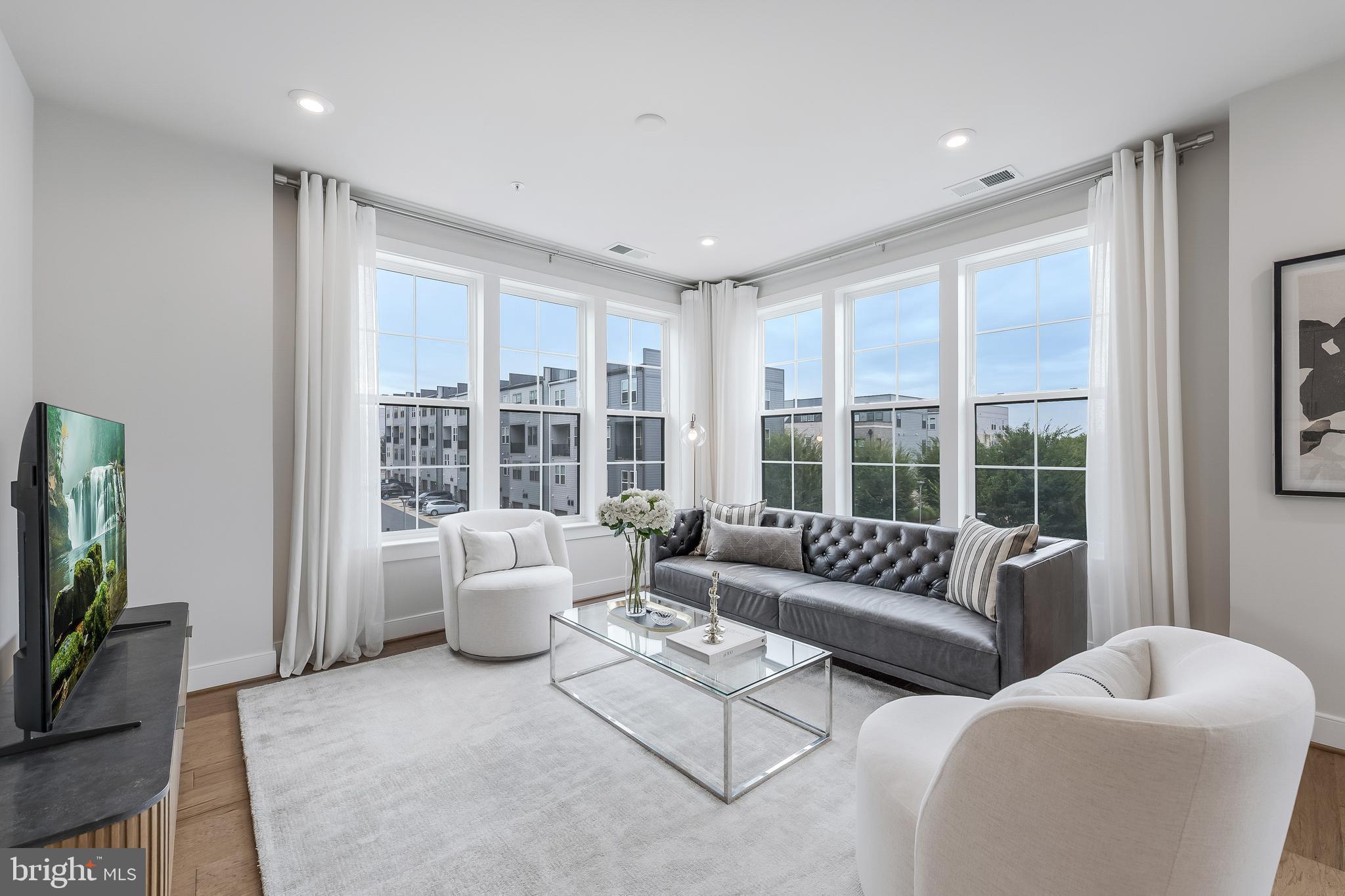 2320 Field Point Road, Unit 201 Herndon, VA 20171 - Photo 23 of 47 a living room with furniture and a large window