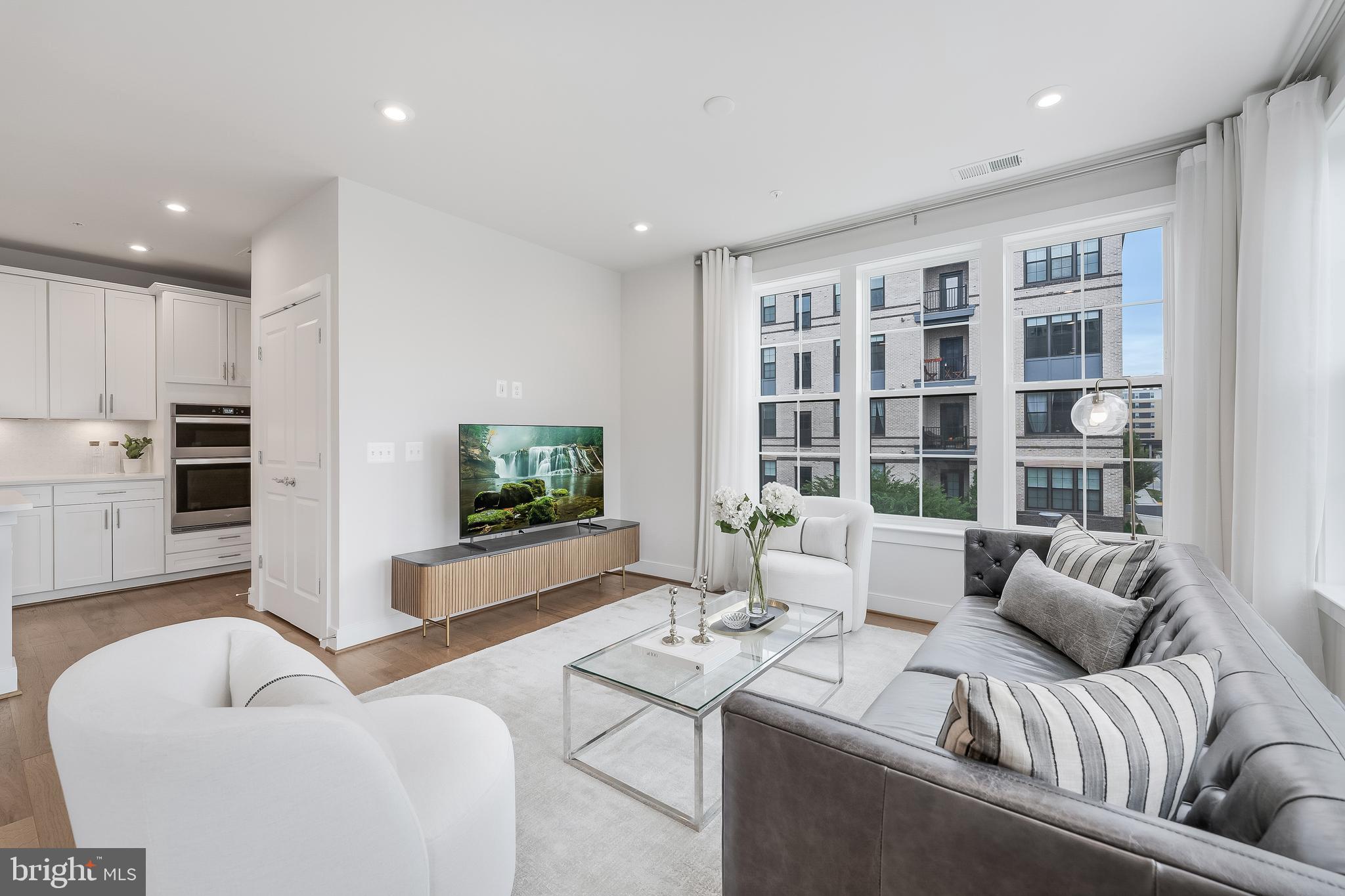 2320 Field Point Road, Unit 201 Herndon, VA 20171 - Photo 24 of 47 a living room with furniture and a flat screen tv