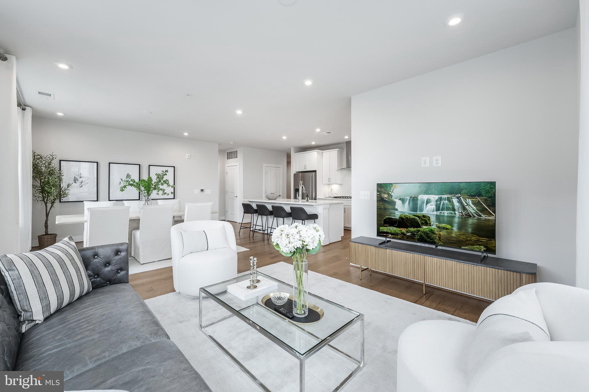 2320 Field Point Road, Unit 201 Herndon, VA 20171 - Photo 25 of 47 a living room with furniture and a flat screen tv