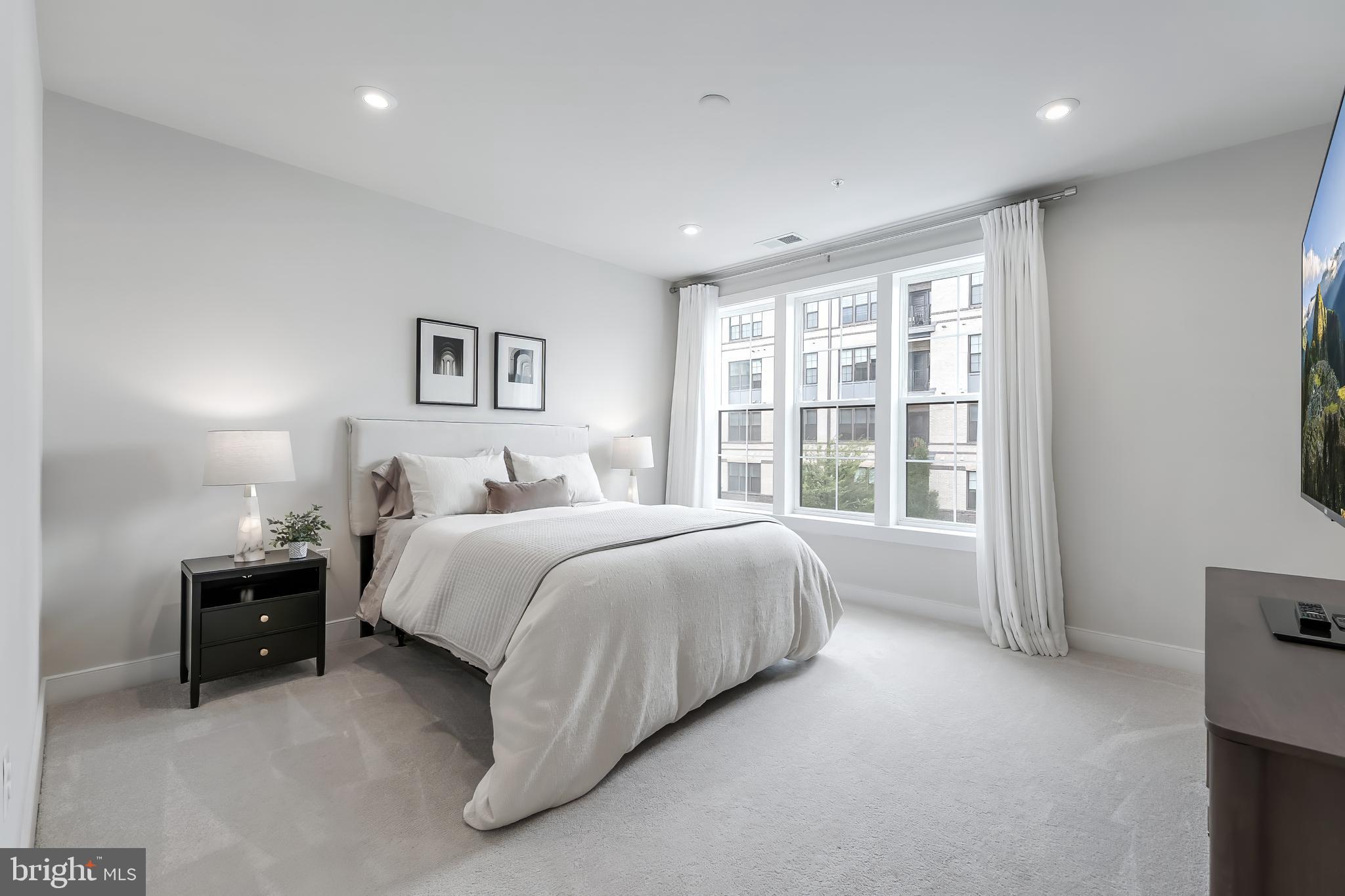 2320 Field Point Road, Unit 201 Herndon, VA 20171 - Photo 26 of 47 a spacious bedroom with a bed and a large window