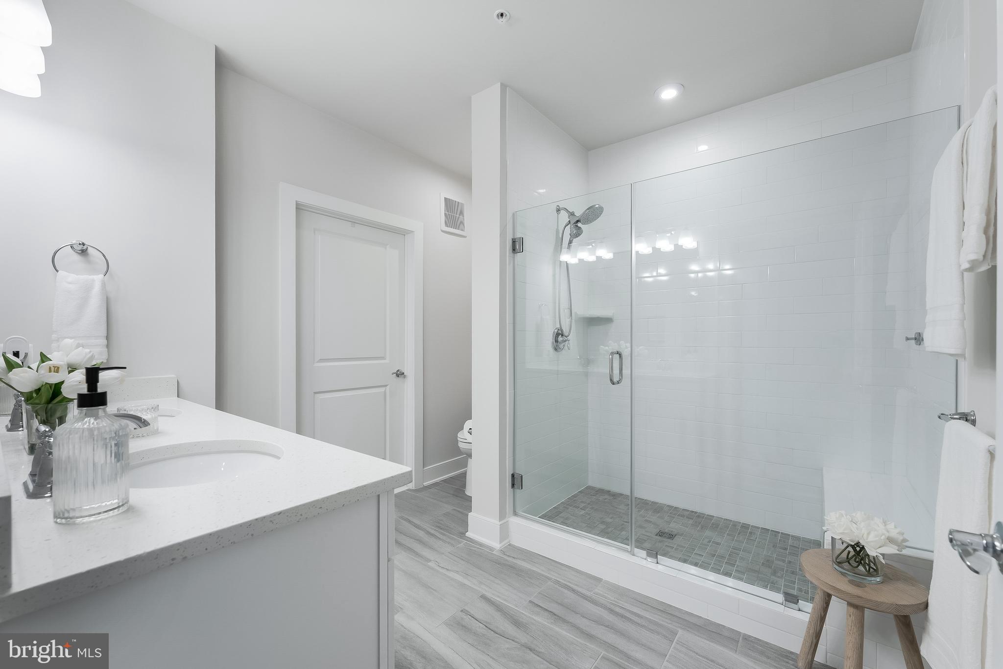 2320 Field Point Road, Unit 201 Herndon, VA 20171 - Photo 27 of 47 a bathroom with a sink shower and a mirror
