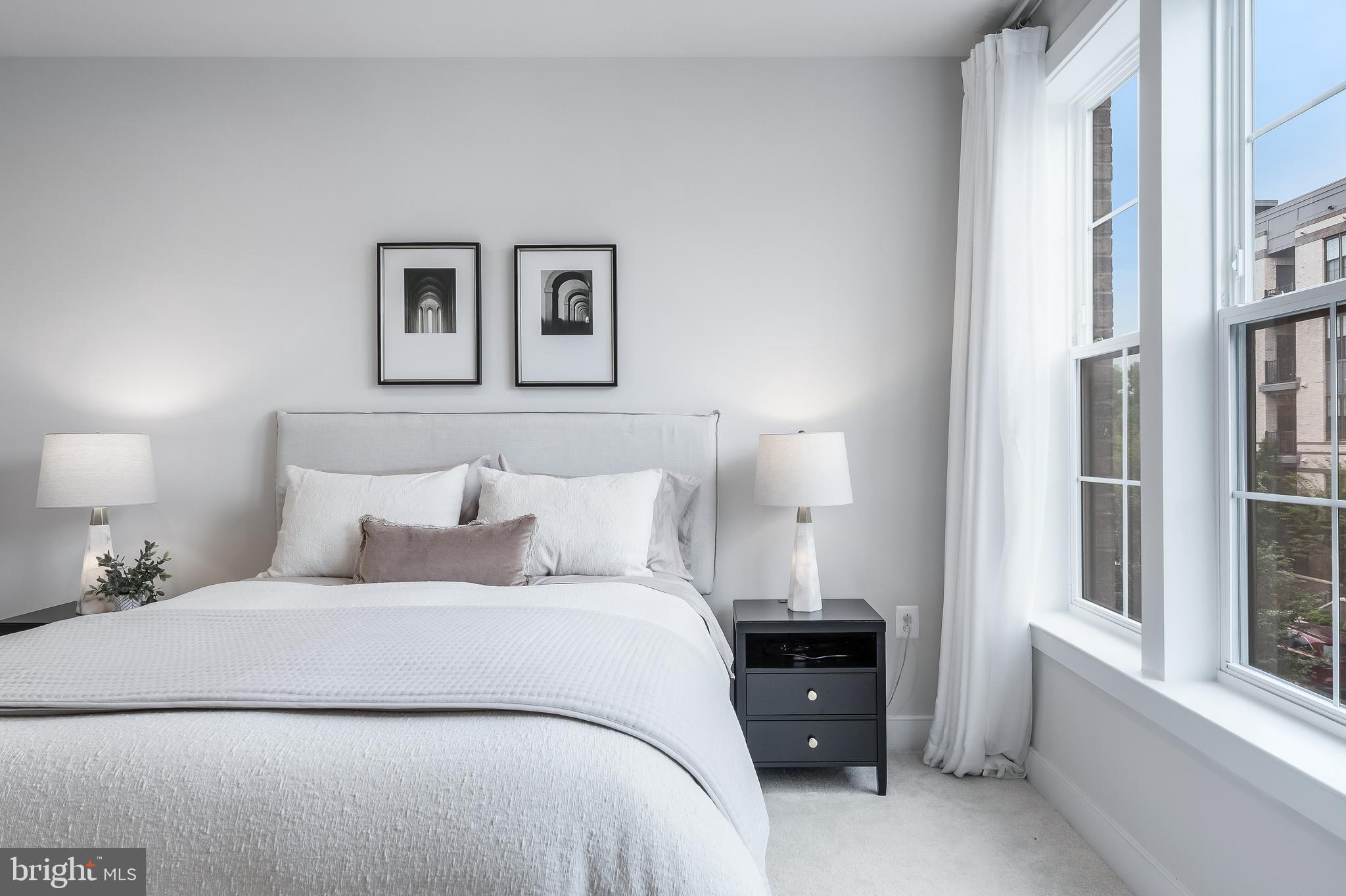 2320 Field Point Road, Unit 201 Herndon, VA 20171 - Photo 30 of 47 a bedroom with a bed and a painting on the wall