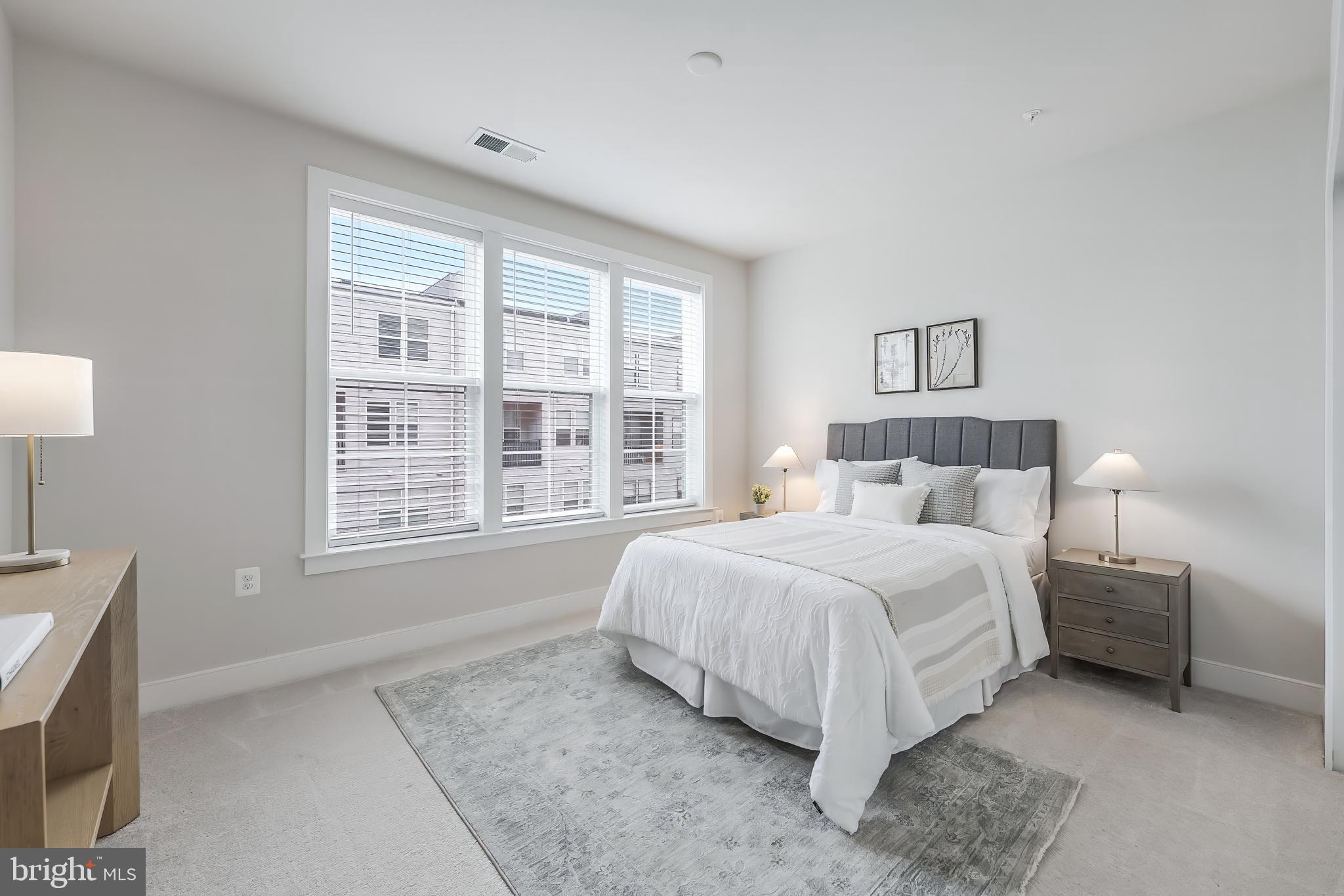 2320 Field Point Road, Unit 201 Herndon, VA 20171 - Photo 33 of 47 a bed sitting in a bedroom next to a window