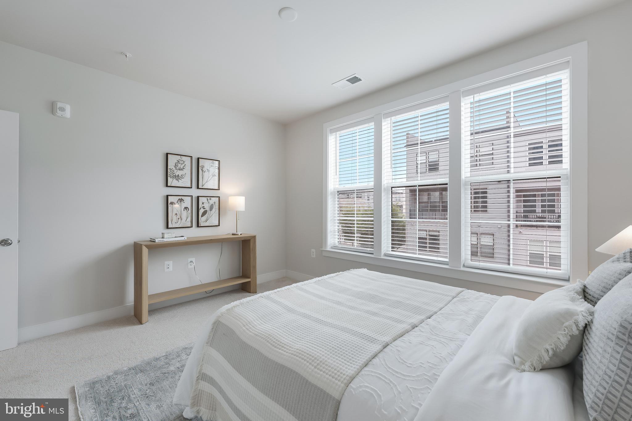 2320 Field Point Road, Unit 201 Herndon, VA 20171 - Photo 35 of 47 a bedroom with a large bed and a window