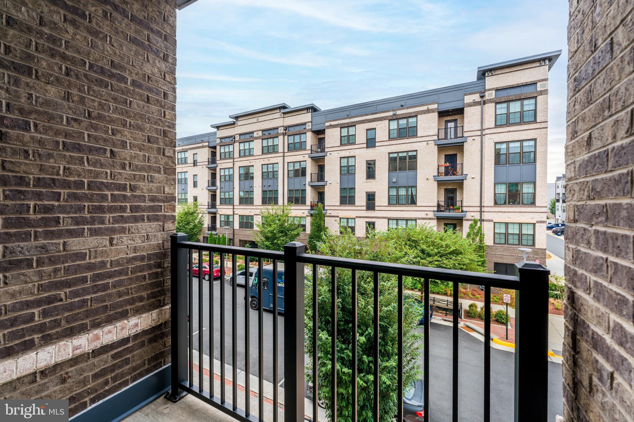 2320 Field Point Road, Unit 201 Herndon, VA 20171 - Photo 41 of 47 a view of a brick building from a balcony