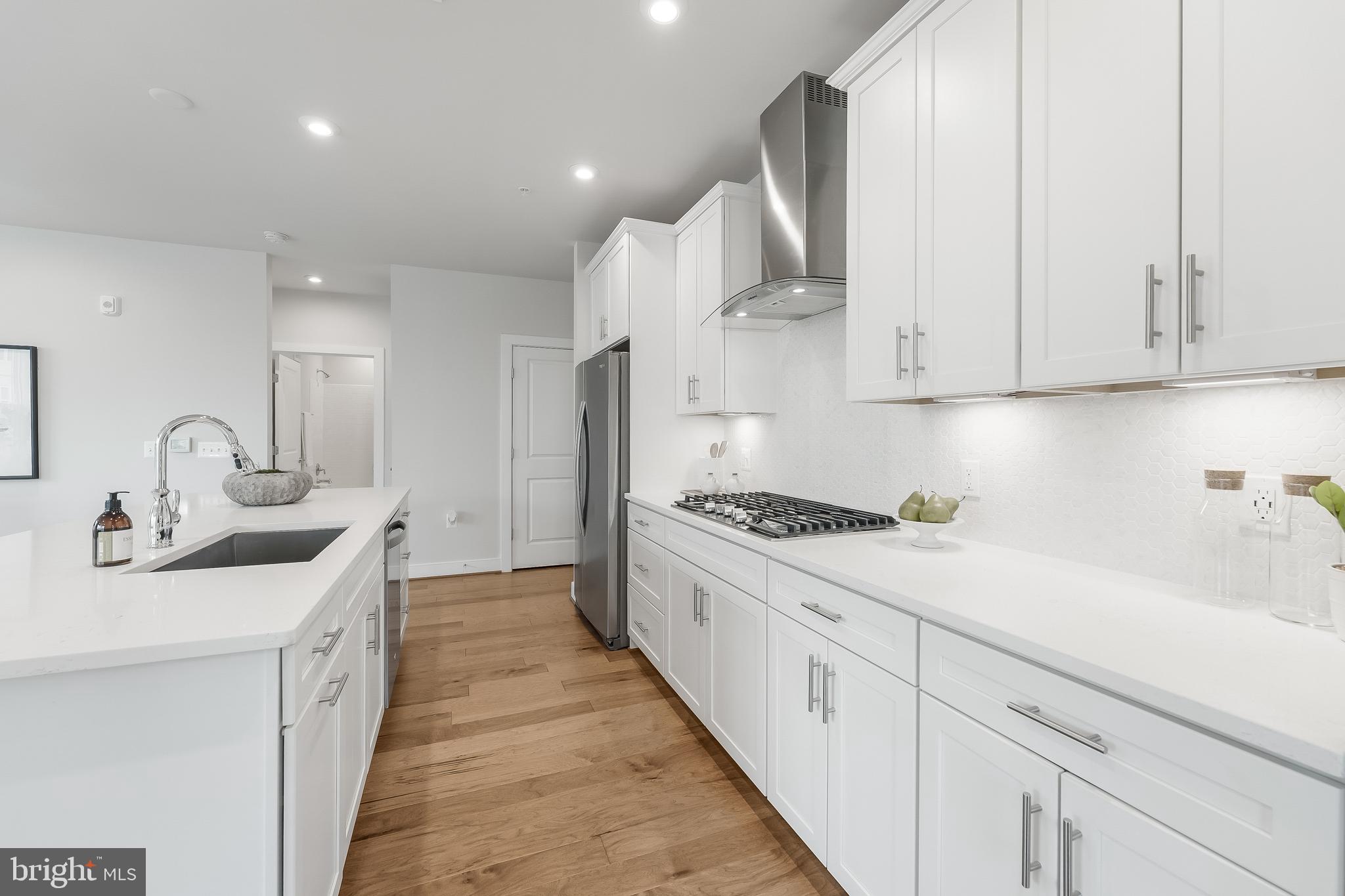 2320 Field Point Road, Unit 201 Herndon, VA 20171 - Photo 10 of 47 a kitchen with stainless steel appliances granite countertop a sink stove and cabinets