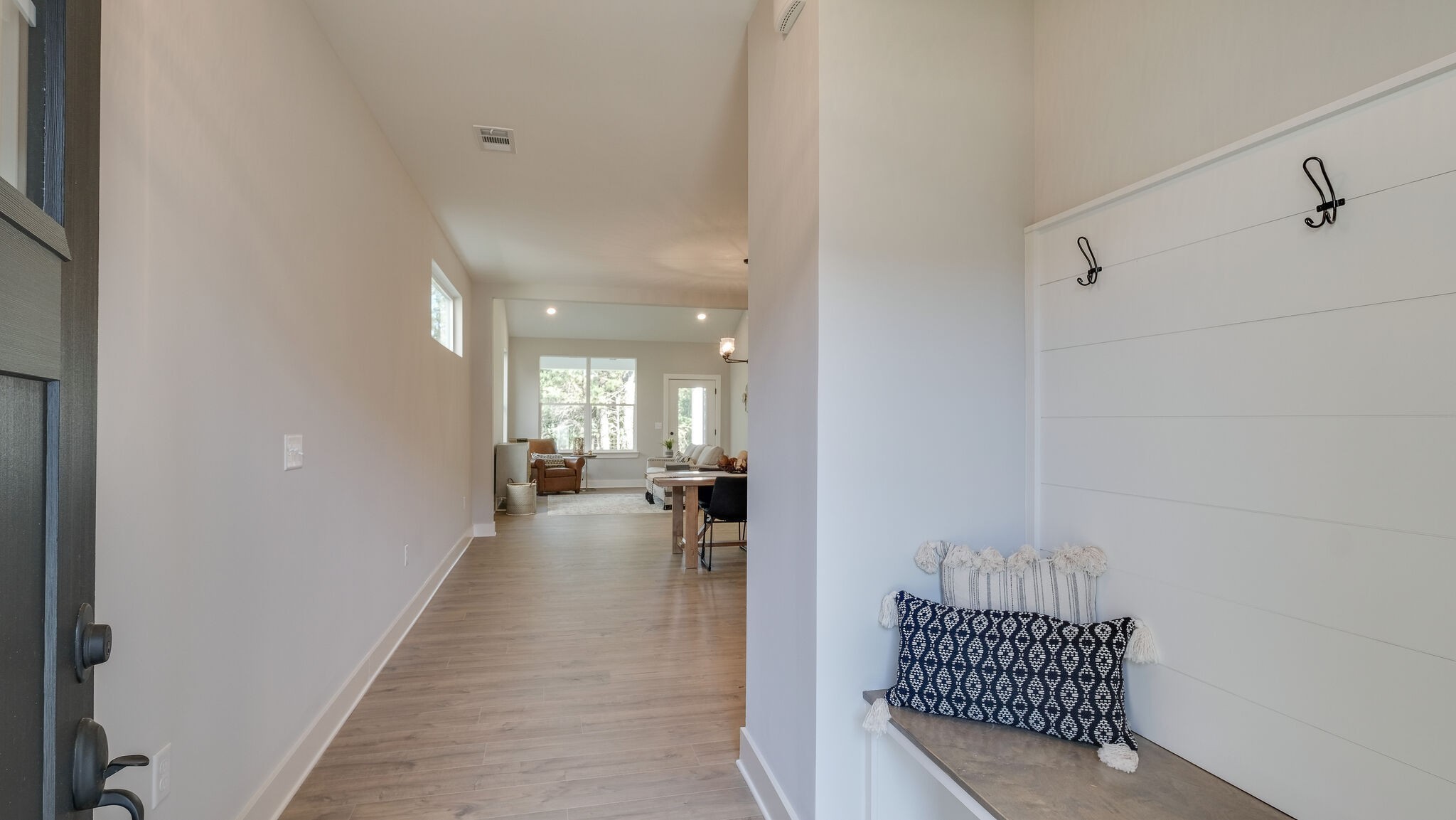 114 Camrose Way Murfreesboro, TN 37128 - Photo 3 of 24 a view of a hallway with a couch and chandelier