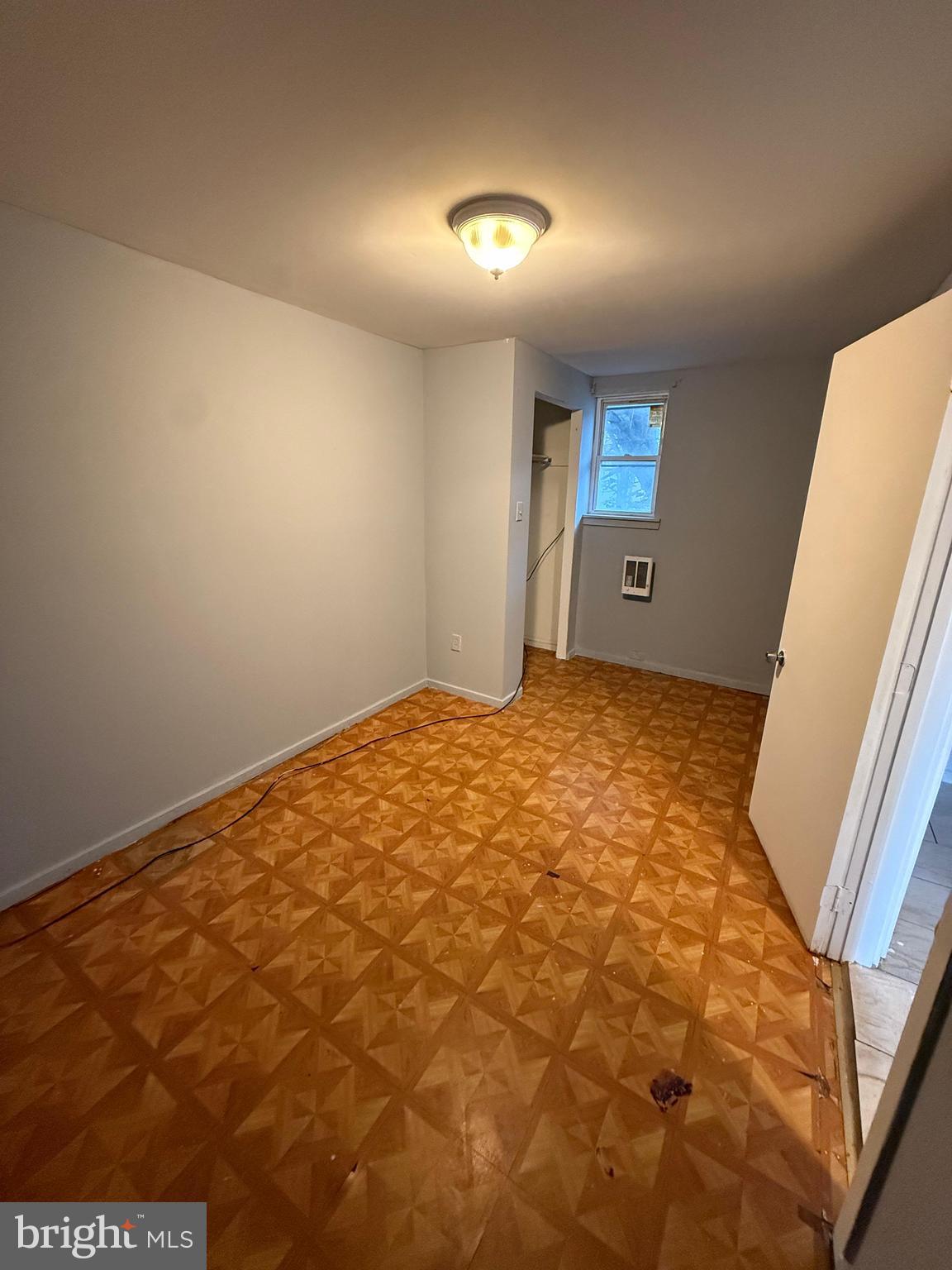 3440 Crystal Street Philadelphia, PA 19134 - Photo 12 of 13 a view of a big room with closet and wooden floor