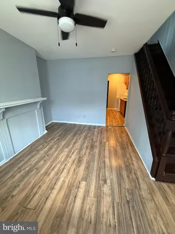 a view of a living room with wooden floor