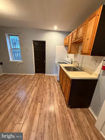 a spacious bathroom with a sink and a mirror