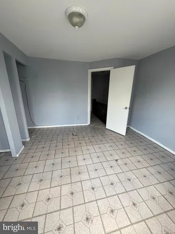 a view of an empty room and entryway