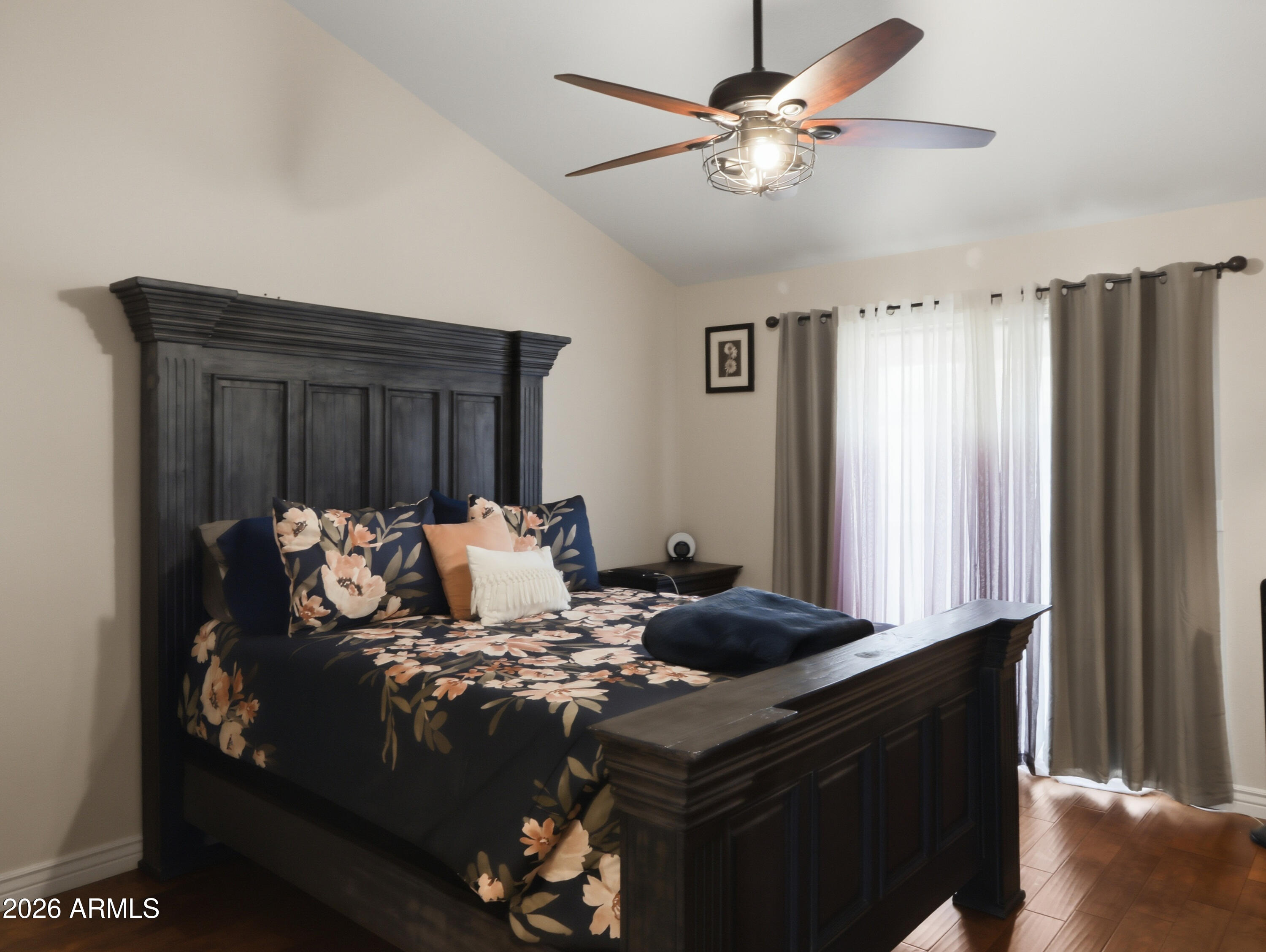 1402 East Osborn Road, Unit 2 Phoenix, AZ 85014 - Photo 12 of 29 a bed sitting in a bedroom next to a window