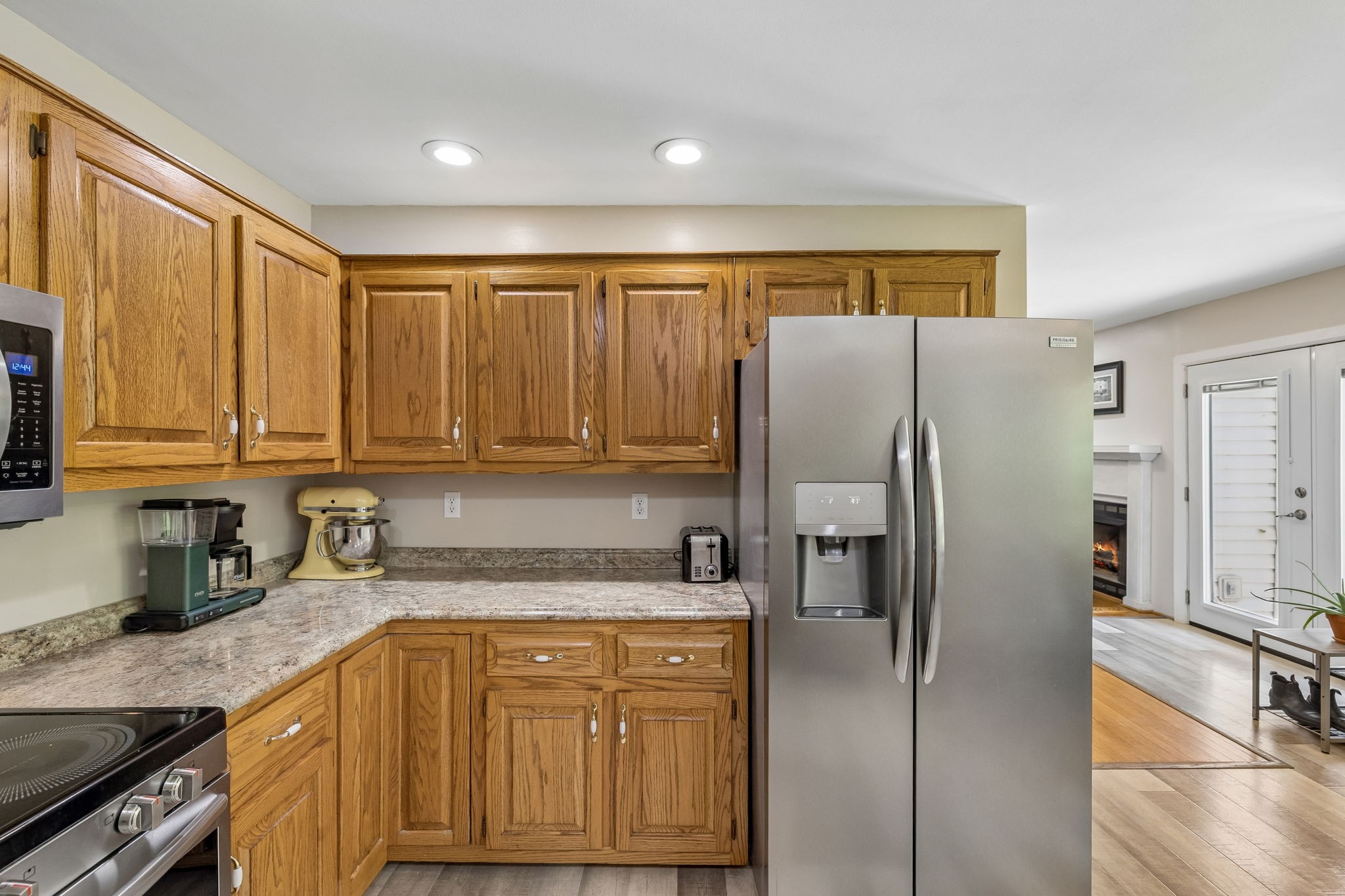 1915 Greenwood Road Charlotte, TN 37036 - Photo 23 of 60 a kitchen with stainless steel appliances granite countertop a refrigerator and a sink