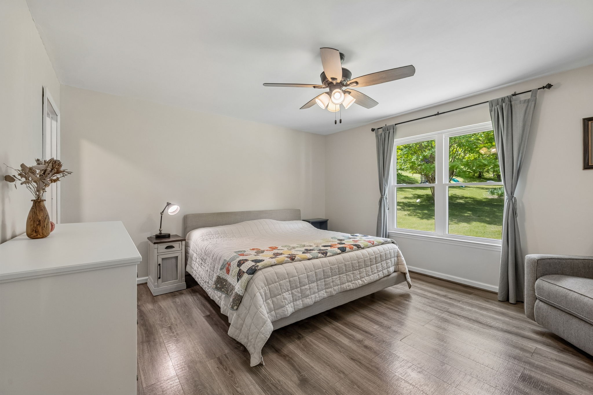 1915 Greenwood Road Charlotte, TN 37036 - Photo 25 of 60 a bedroom with a bed and wooden floor