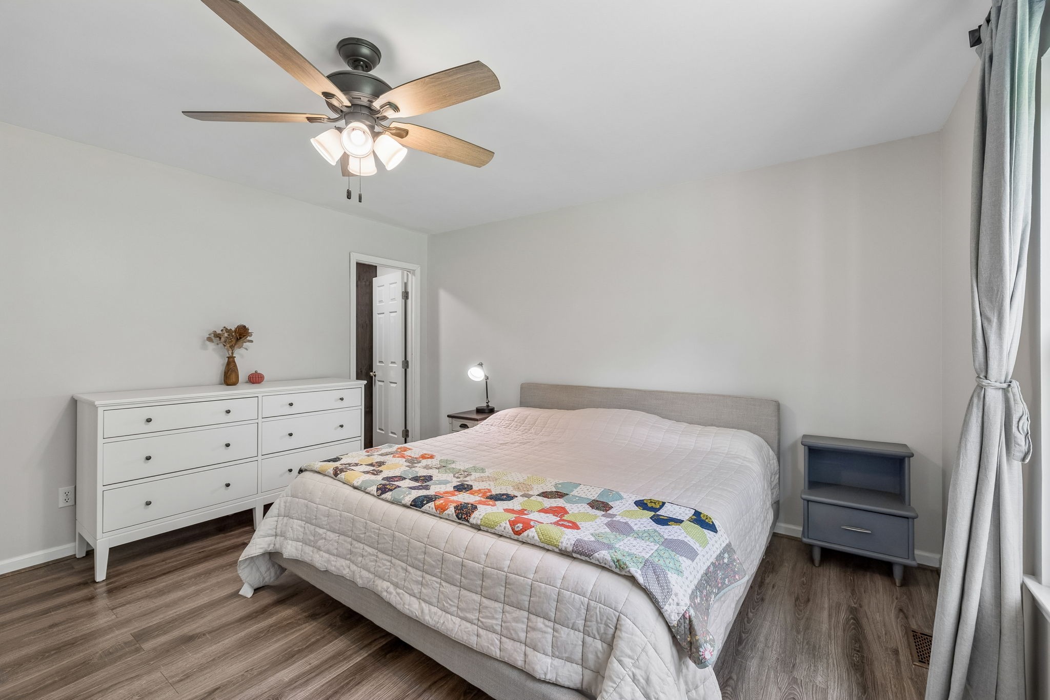 1915 Greenwood Road Charlotte, TN 37036 - Photo 26 of 60 a bedroom with a bed and a chandelier