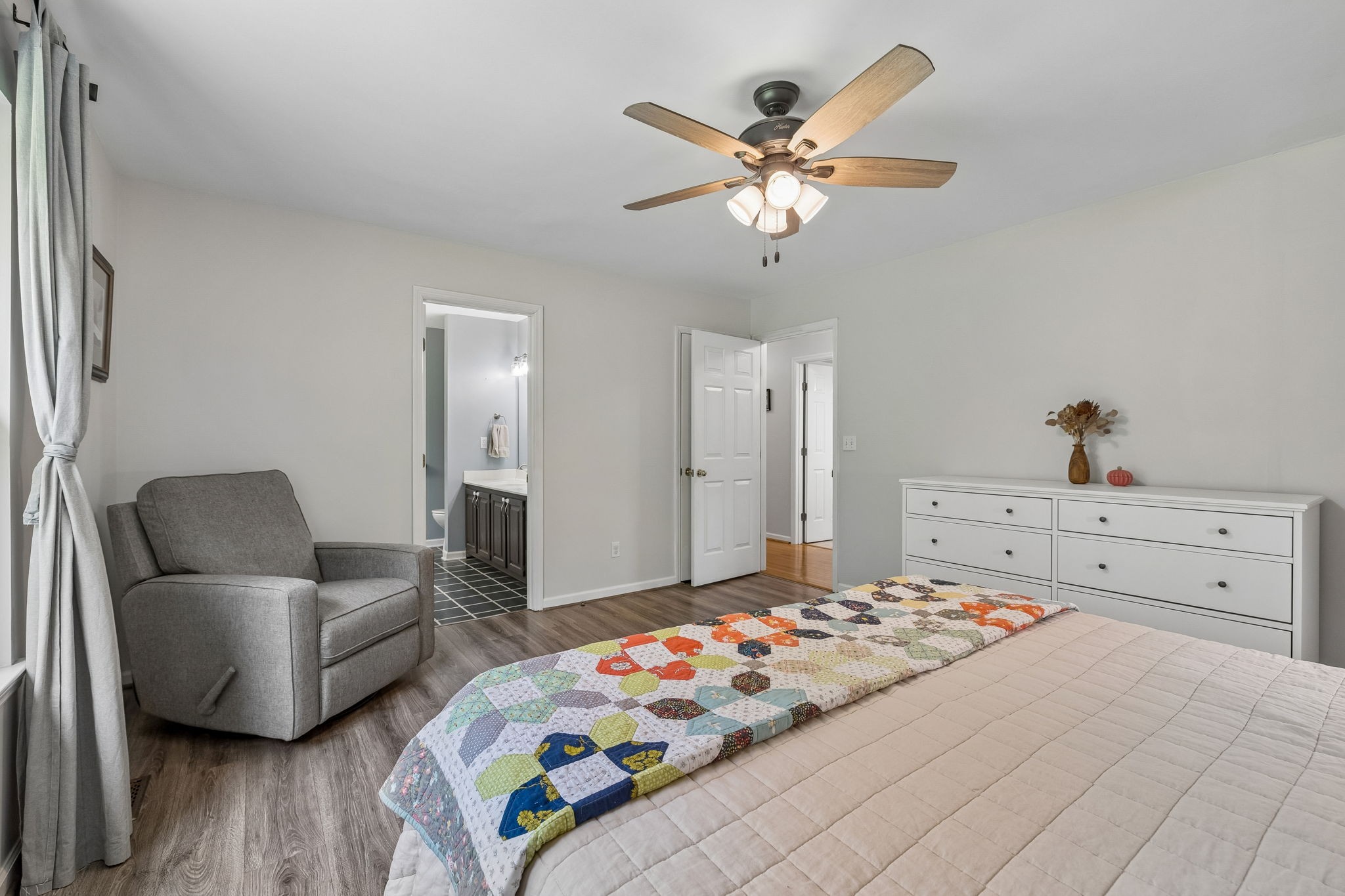 1915 Greenwood Road Charlotte, TN 37036 - Photo 28 of 60 a bedroom with a bed and wooden floor