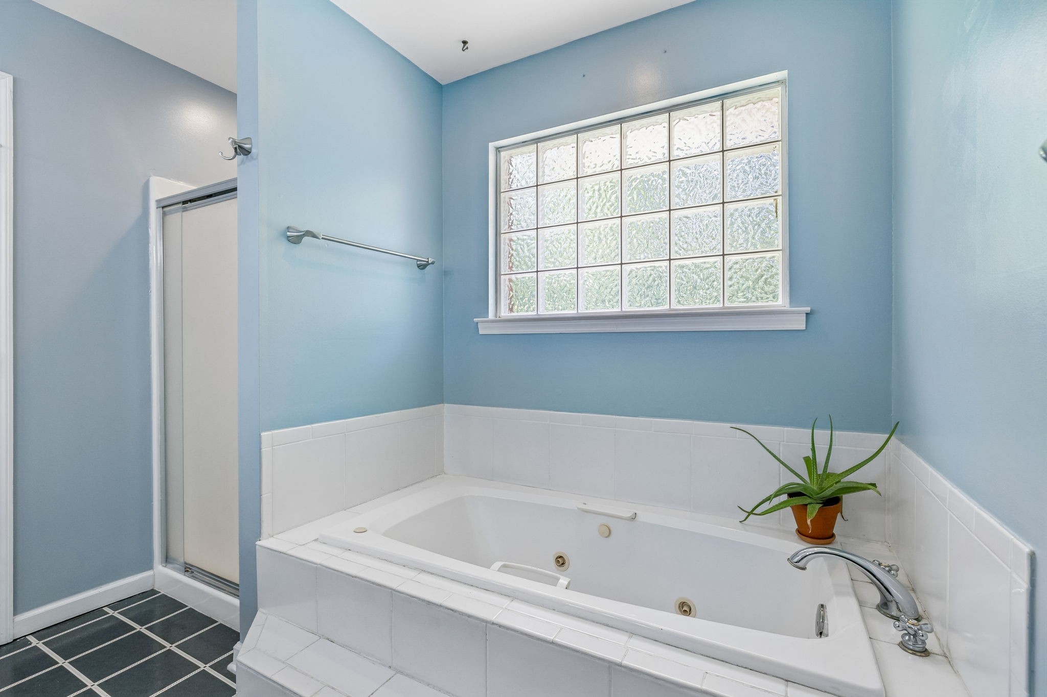 1915 Greenwood Road Charlotte, TN 37036 - Photo 30 of 60 a white bath tub and a window in a bathroom