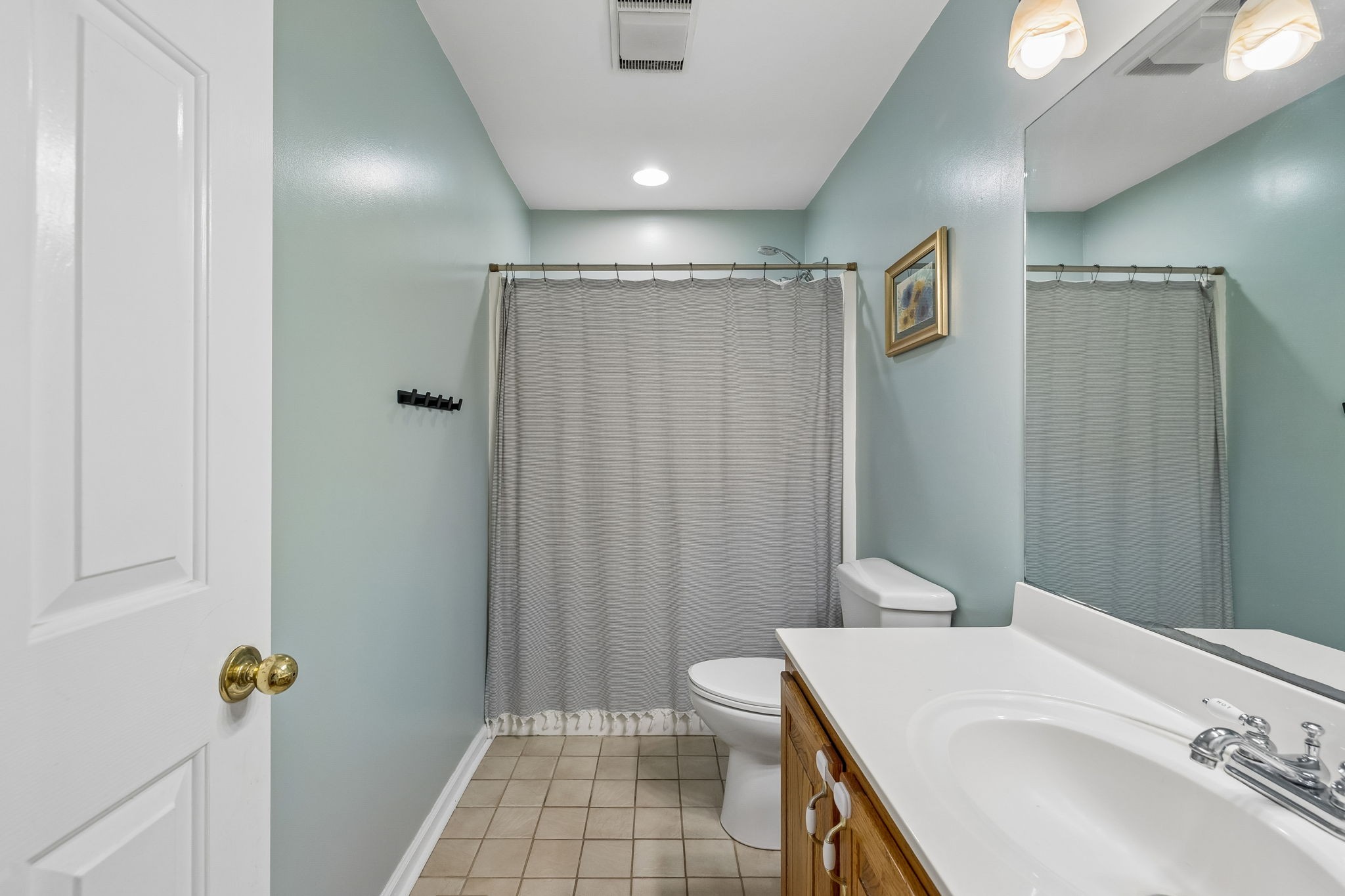 1915 Greenwood Road Charlotte, TN 37036 - Photo 33 of 60 a bathroom with a sink a toilet and shower