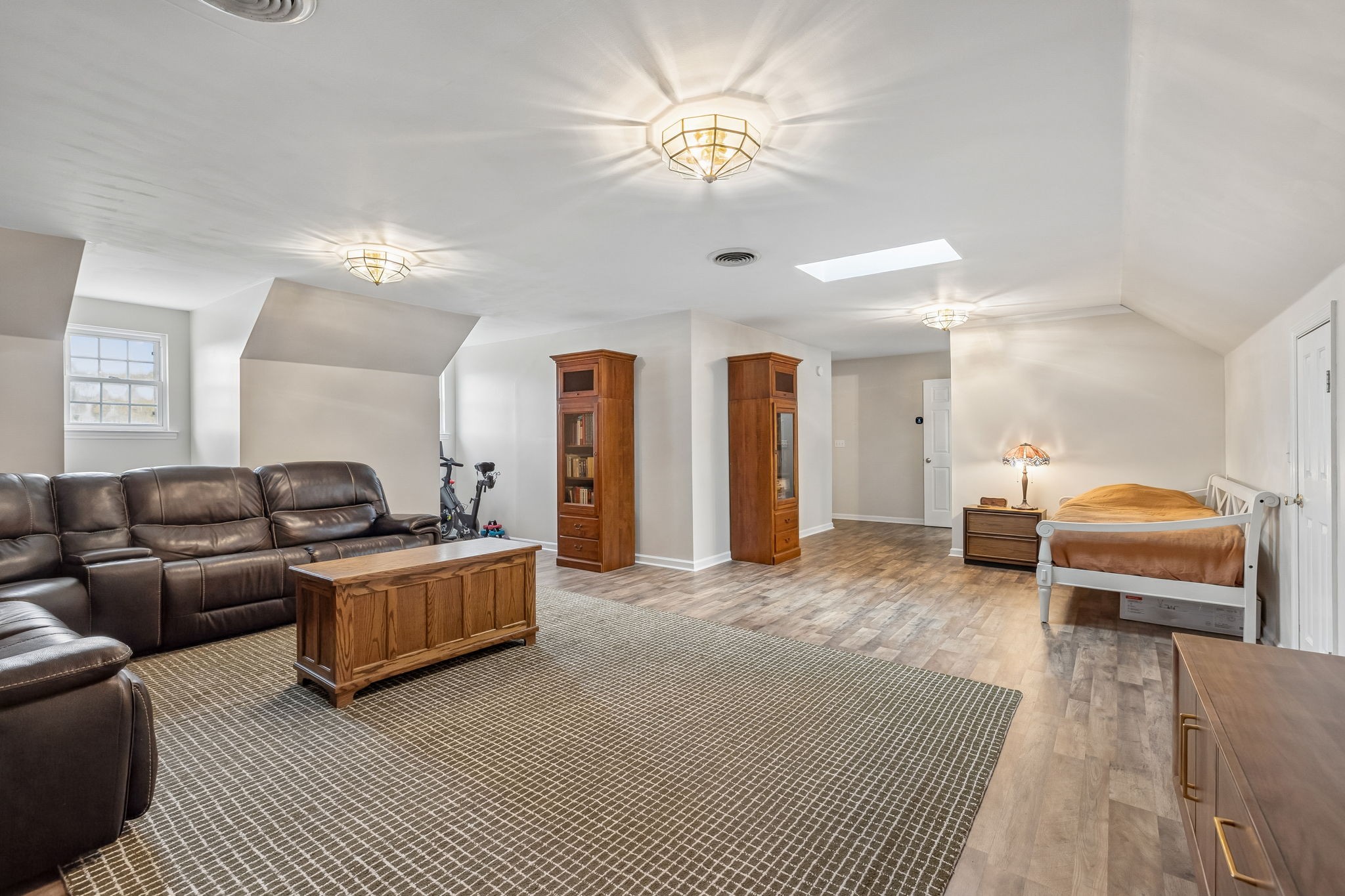 1915 Greenwood Road Charlotte, TN 37036 - Photo 36 of 60 a living room with furniture and a chandelier